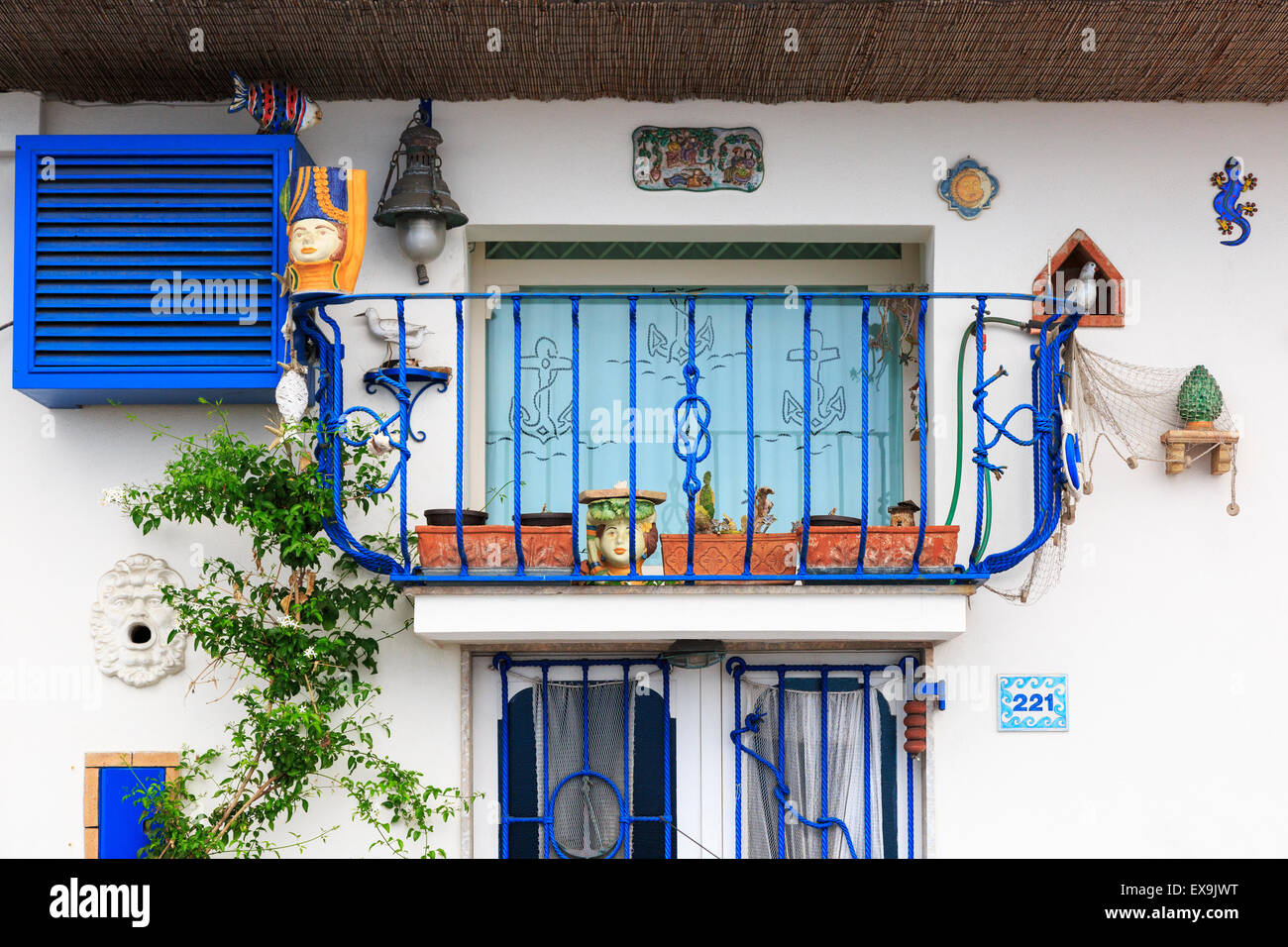 Colourful balcony on a house in Giardini Naxos, Messina district, Sicily, Italy Stock Photo