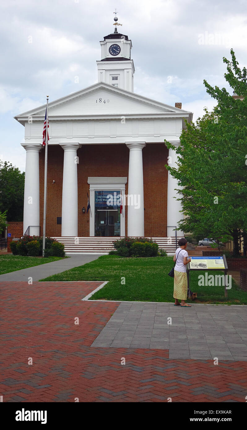 Woman stops to read the sign in front of the Old Court House civil war museum on the Old Town Mall, Winchester, Virginia Stock Photo