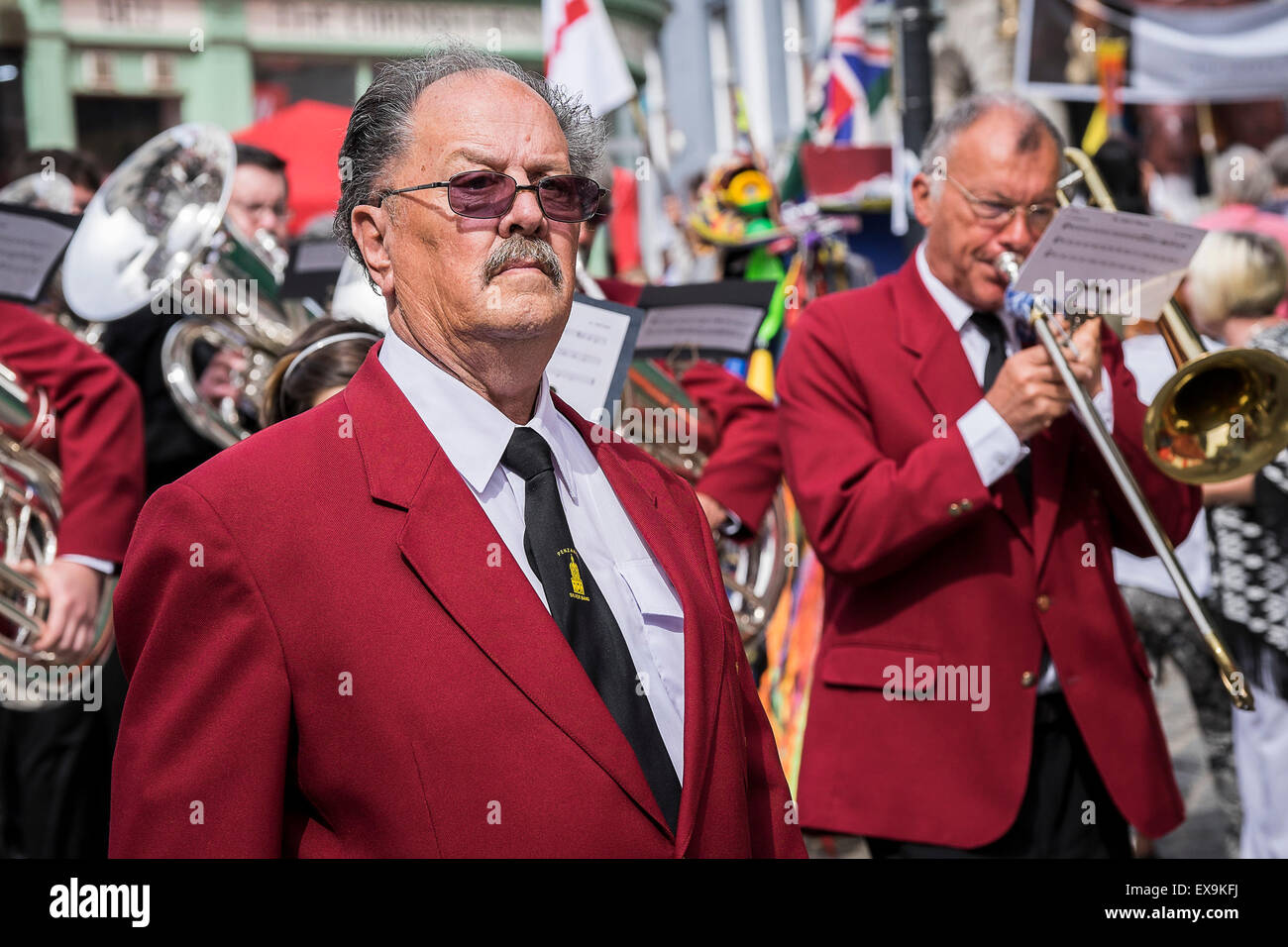 The Penzance Silver Band marching in one of the colourful parades on Mazey Day, part of the Golowan Festival in Penzance, Cornwa Stock Photo
