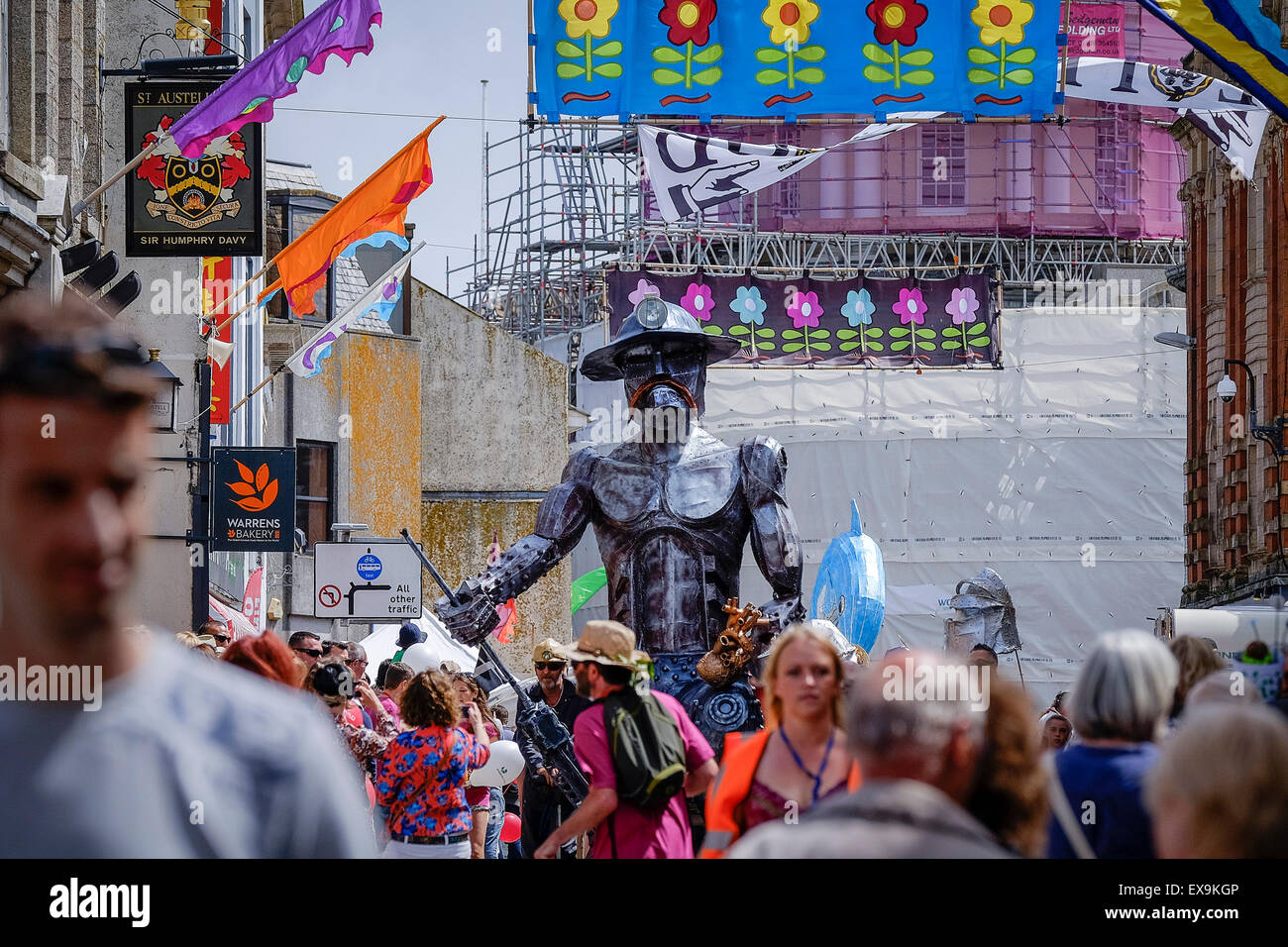A huge effigy of a Cornish tin miner being carried during one of the colourful parades on Mazey Day, part of the Golowan Festiva Stock Photo