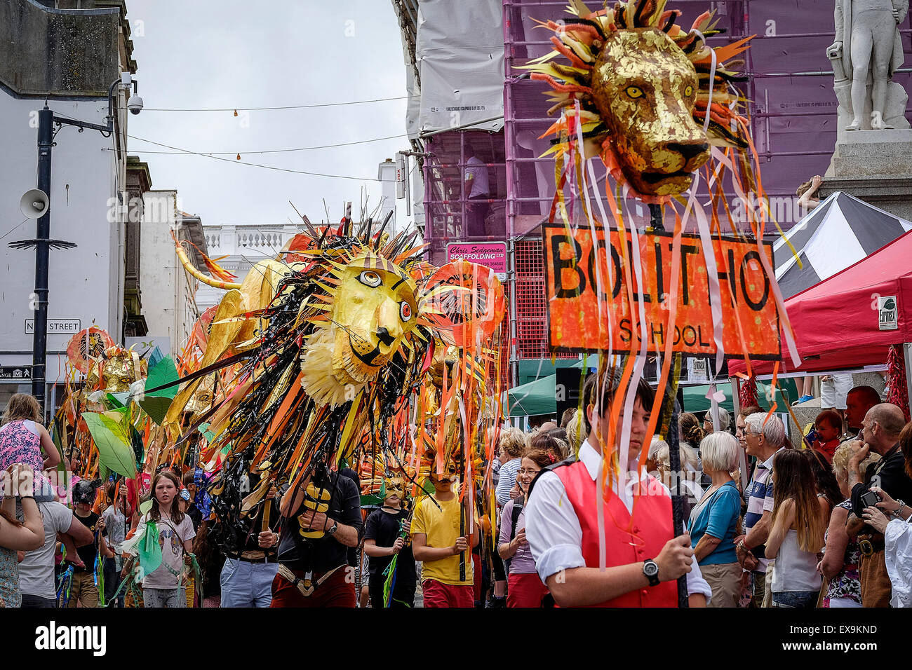 Large effigies of Lions carried by students from Bolitho School in colourful parades on Mazey Day, part of the Golowan Festival. Stock Photo