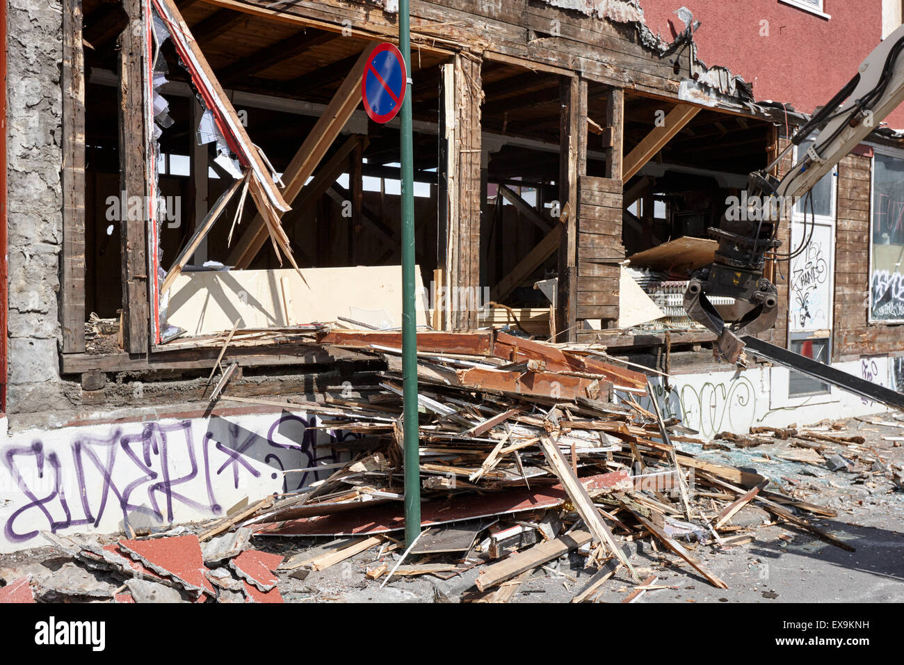 demolishing stucco corrugated iron clad wood framed building reykjavik
