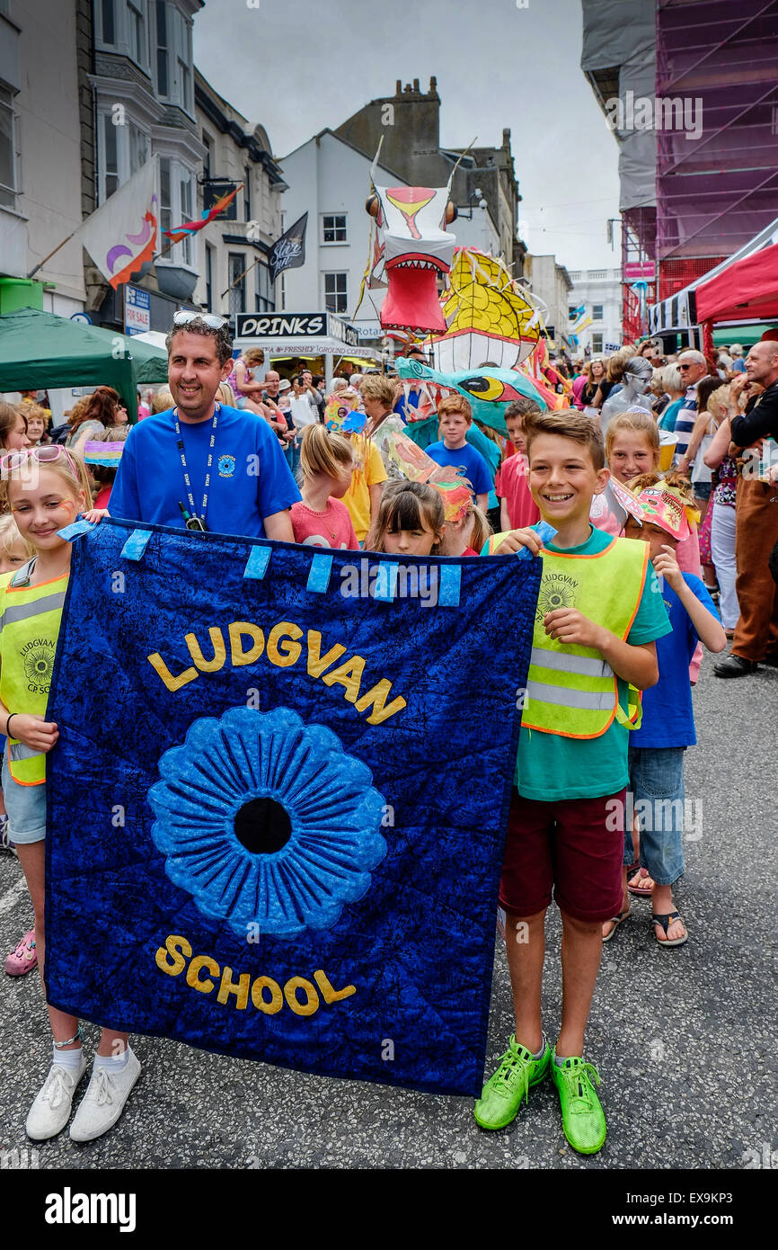 Pupils from Ludgvan School in one of the colourful parades on Mazey Day, part of the Golowan Festival in Penzance, Cornwall. Stock Photo
