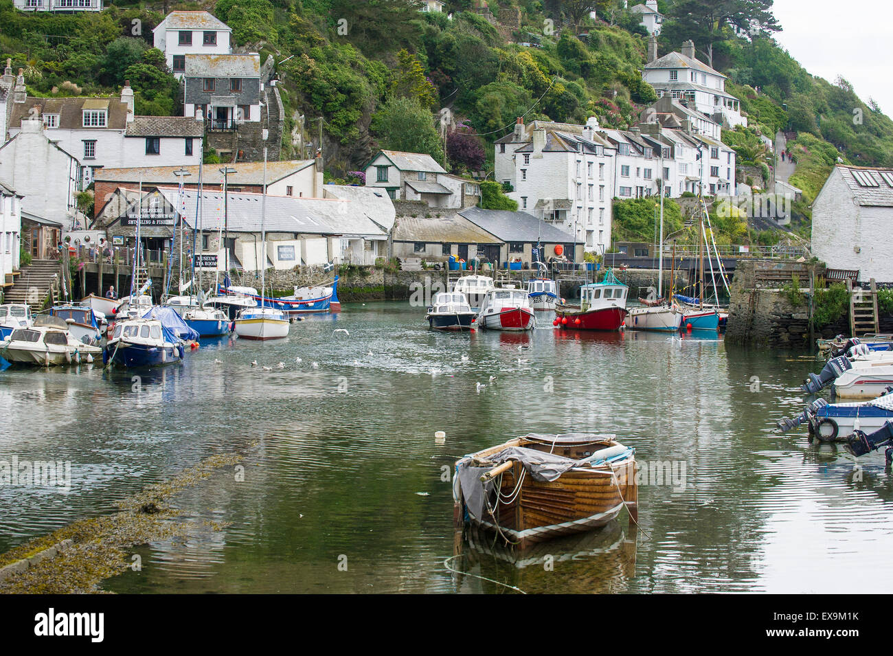 Boats moored in the harbour in the picturesque and historic fishing village of Polperro in Cornwall. Stock Photo