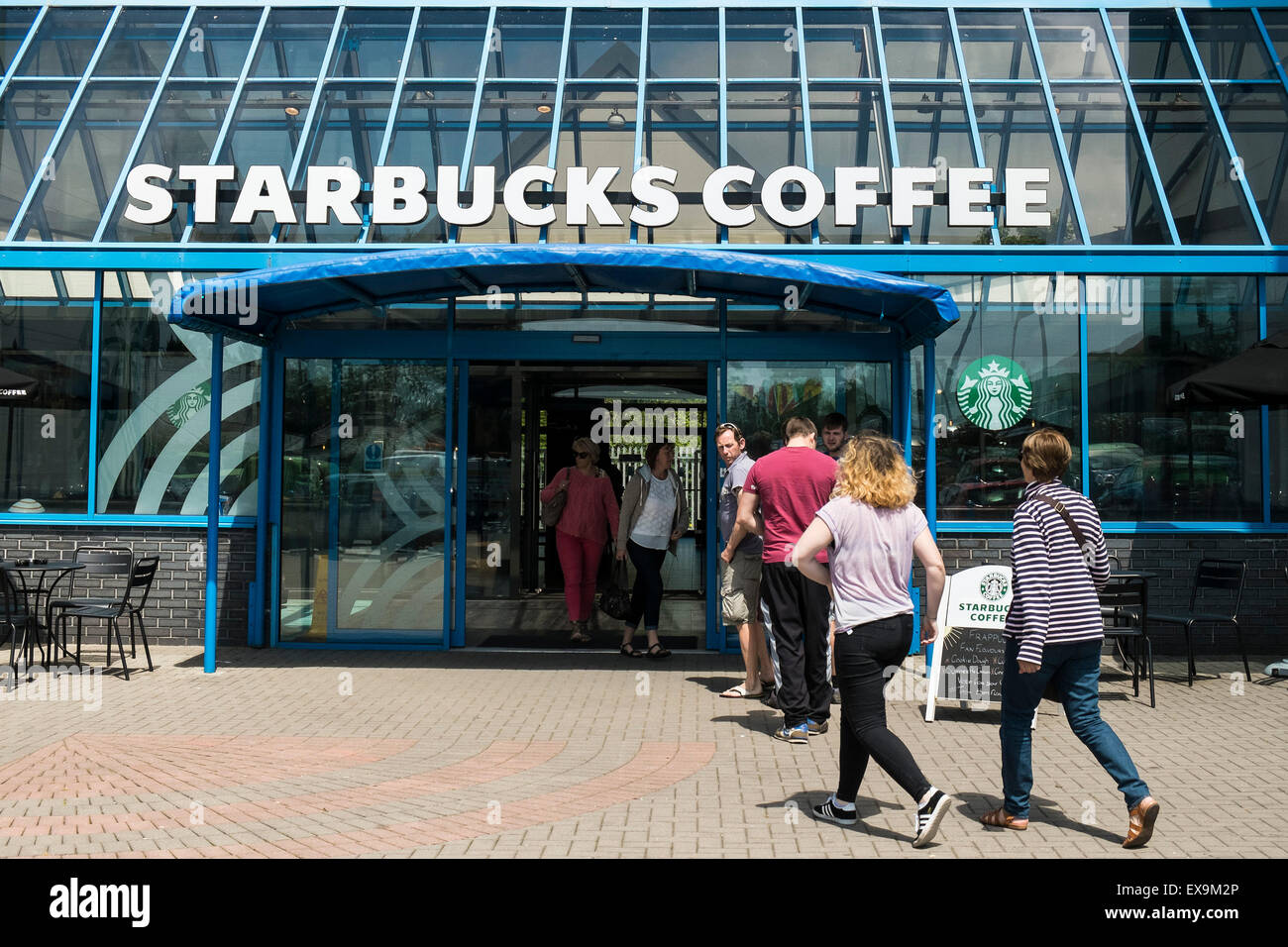 Customers entering a Starbucks Coffee Shop. Stock Photo