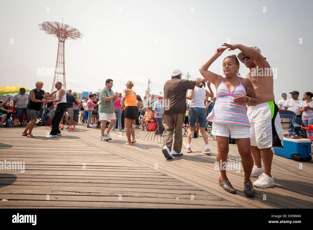 Dancing to salsa on the boardwalk on a seasonably warm Sunday, July 5