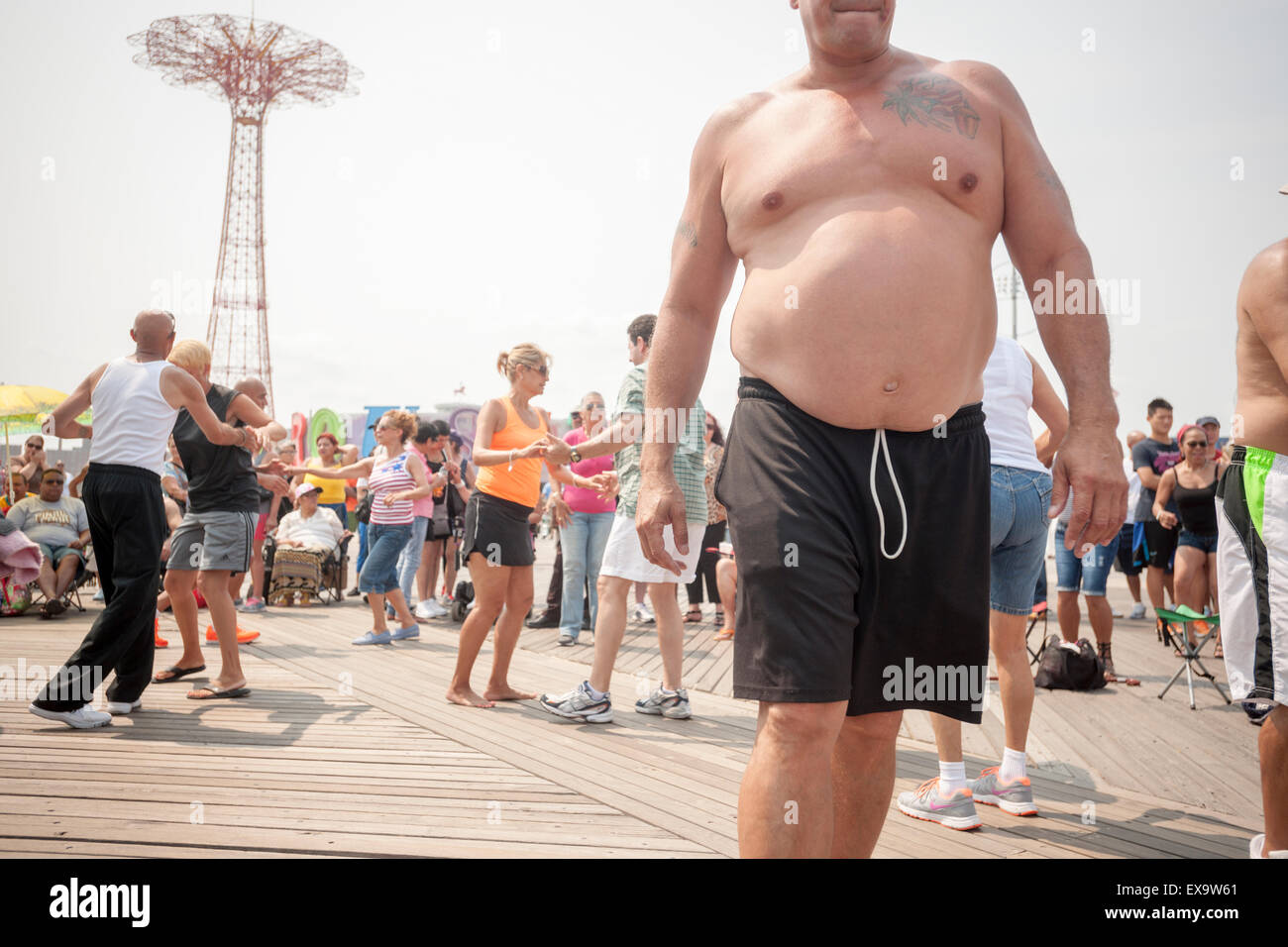 Dancing to salsa on the boardwalk on a seasonably warm Sunday, July 5