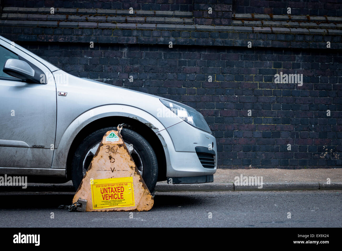Car clamped for being an untaxed vehicle Stock Photo Alamy