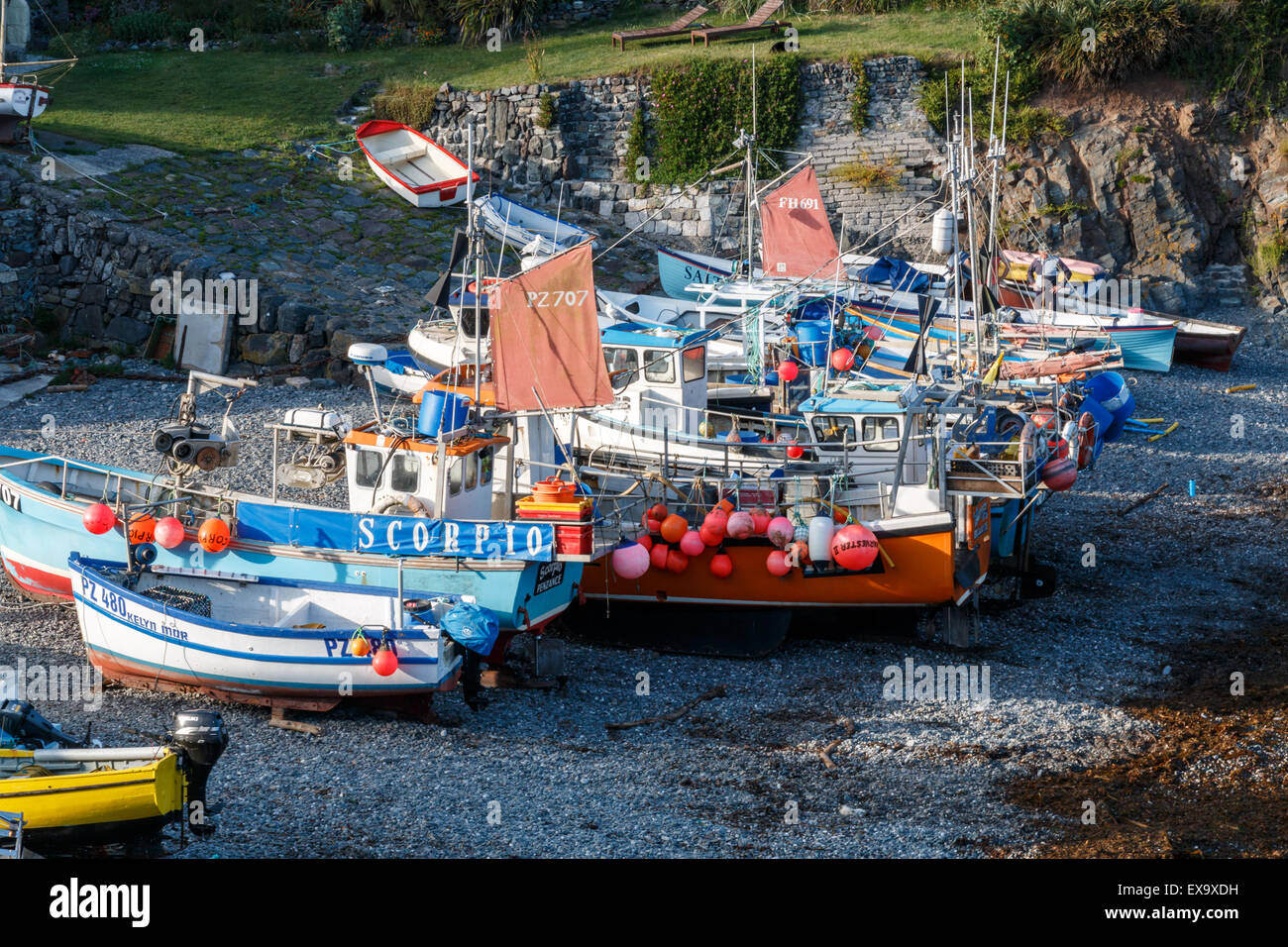 Cadgwith Cove in Cornwall has fishing boats drawn up on the beach at