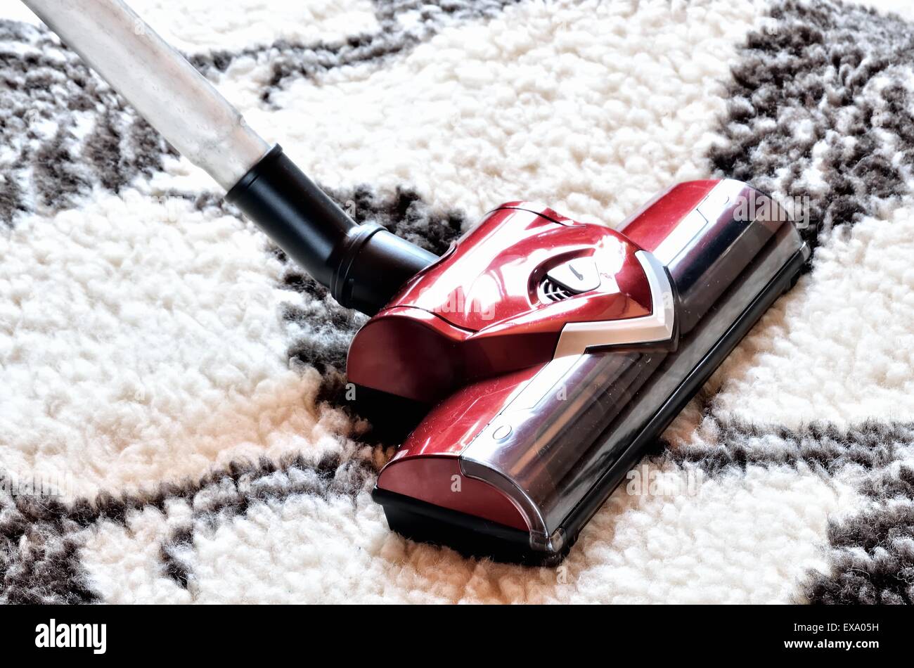 Vacuum cleaner. Close up of the head of a modern hoover being used