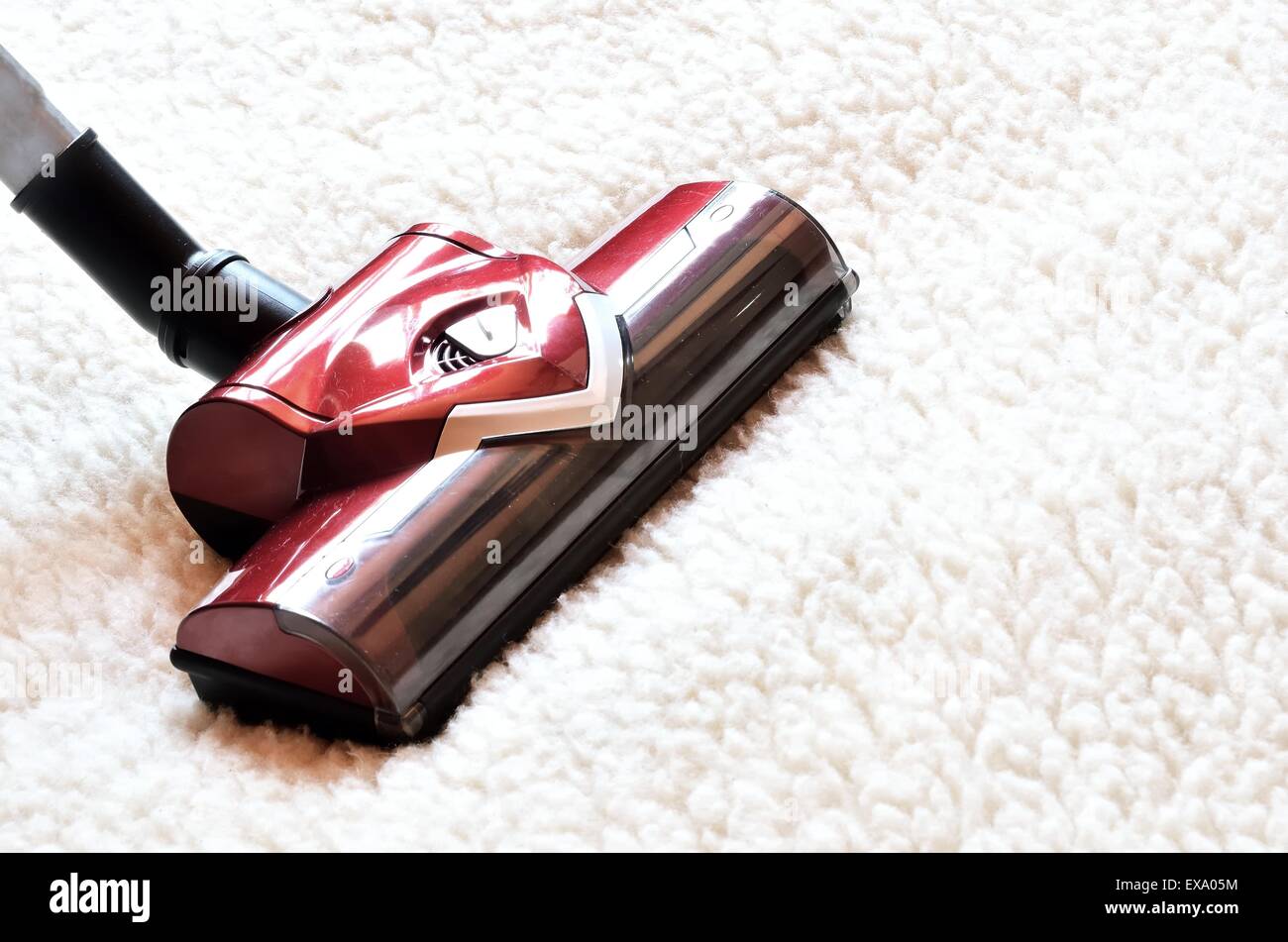 Vacuum cleaner. Close up of the head of a modern hoover being used