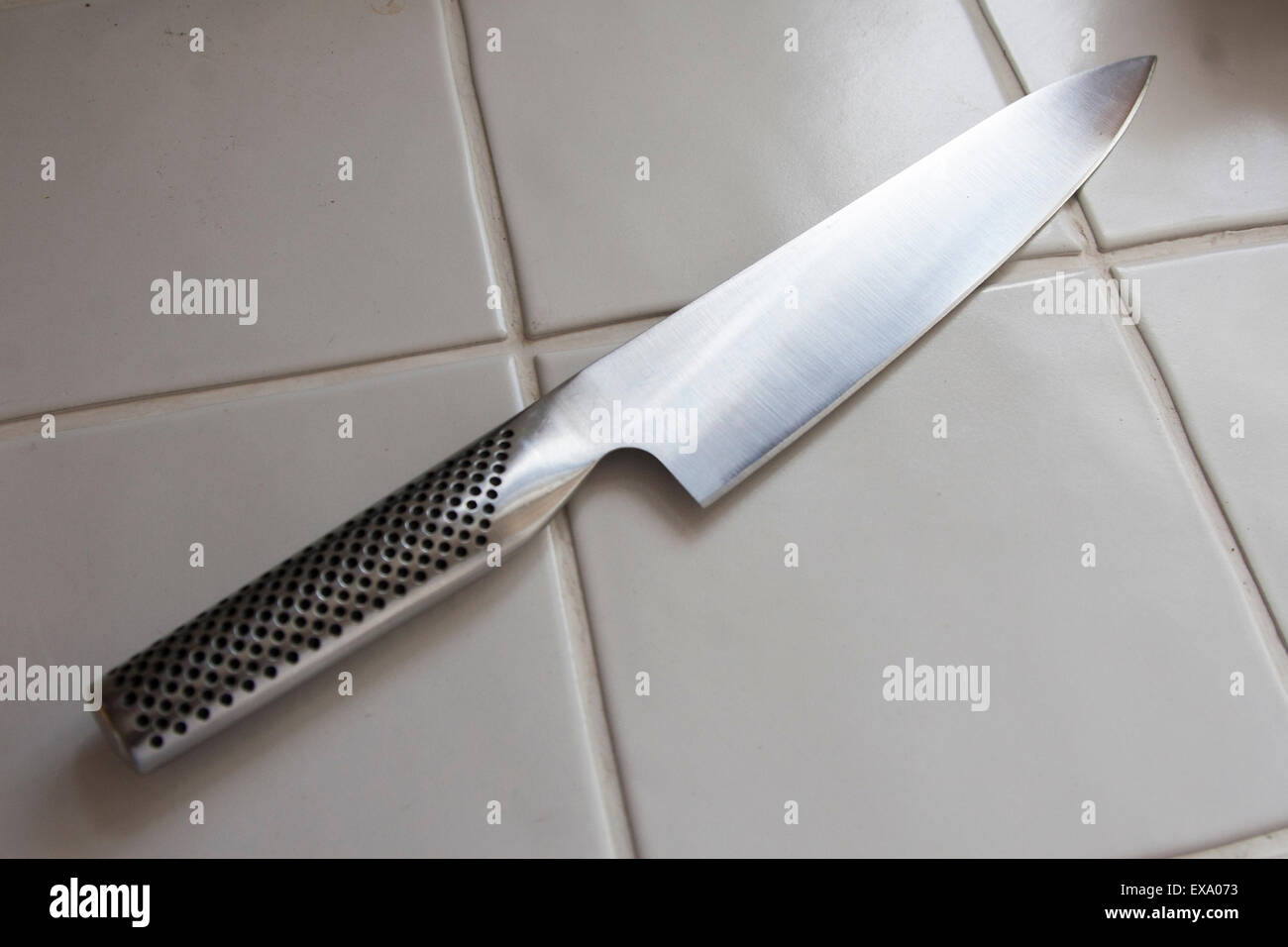 Chef's knife on the kitchen counter. Stock Photo