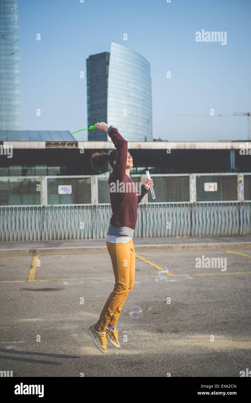 young beautiful hipster woman bubble blower in the city Stock Photo - Alamy