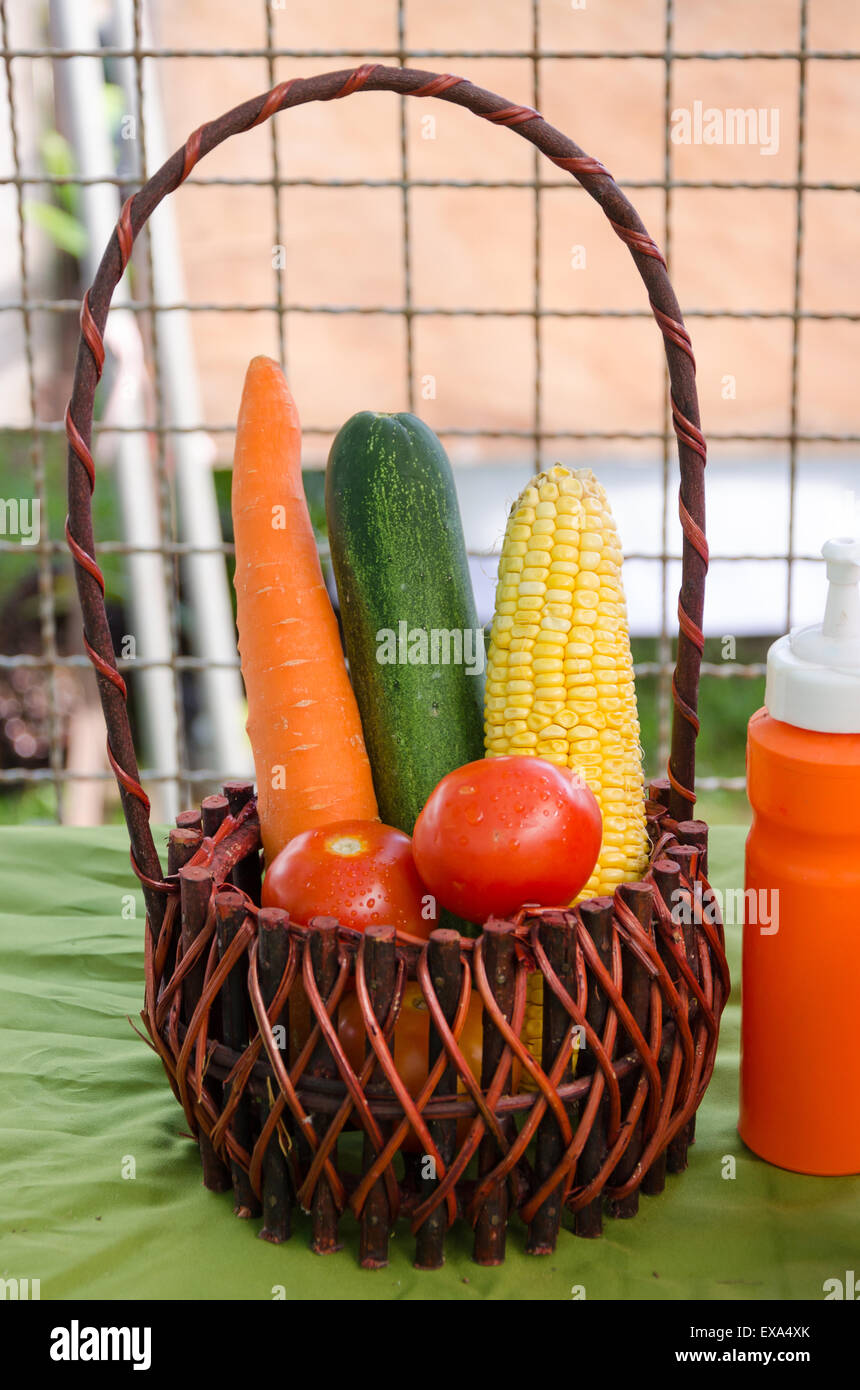 Group of colorful vegetables in a wicker basket. Stock Photo