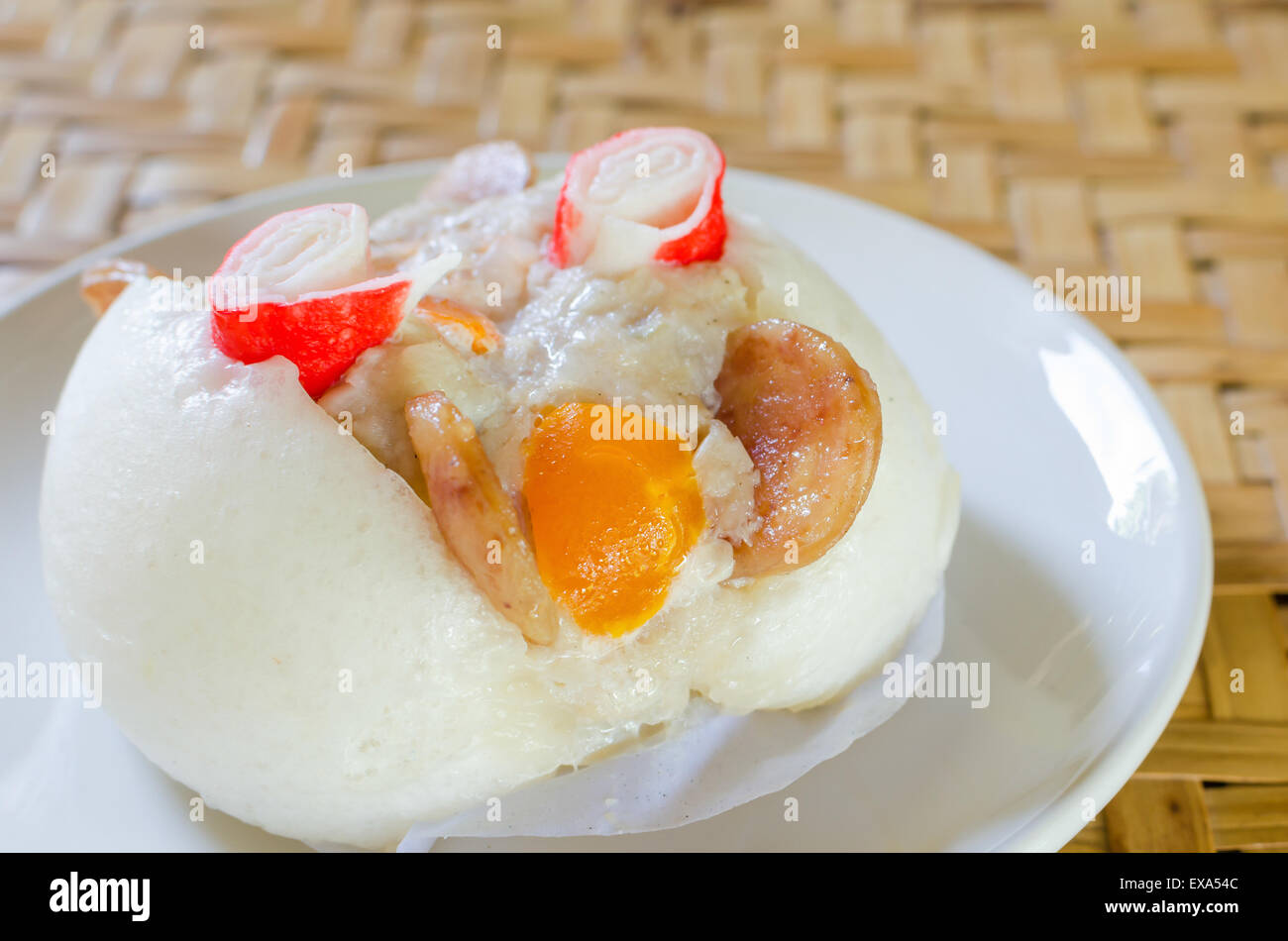 Chinese steamed bun stuffed with  pork,sausage,egg yolk and crab. Stock Photo