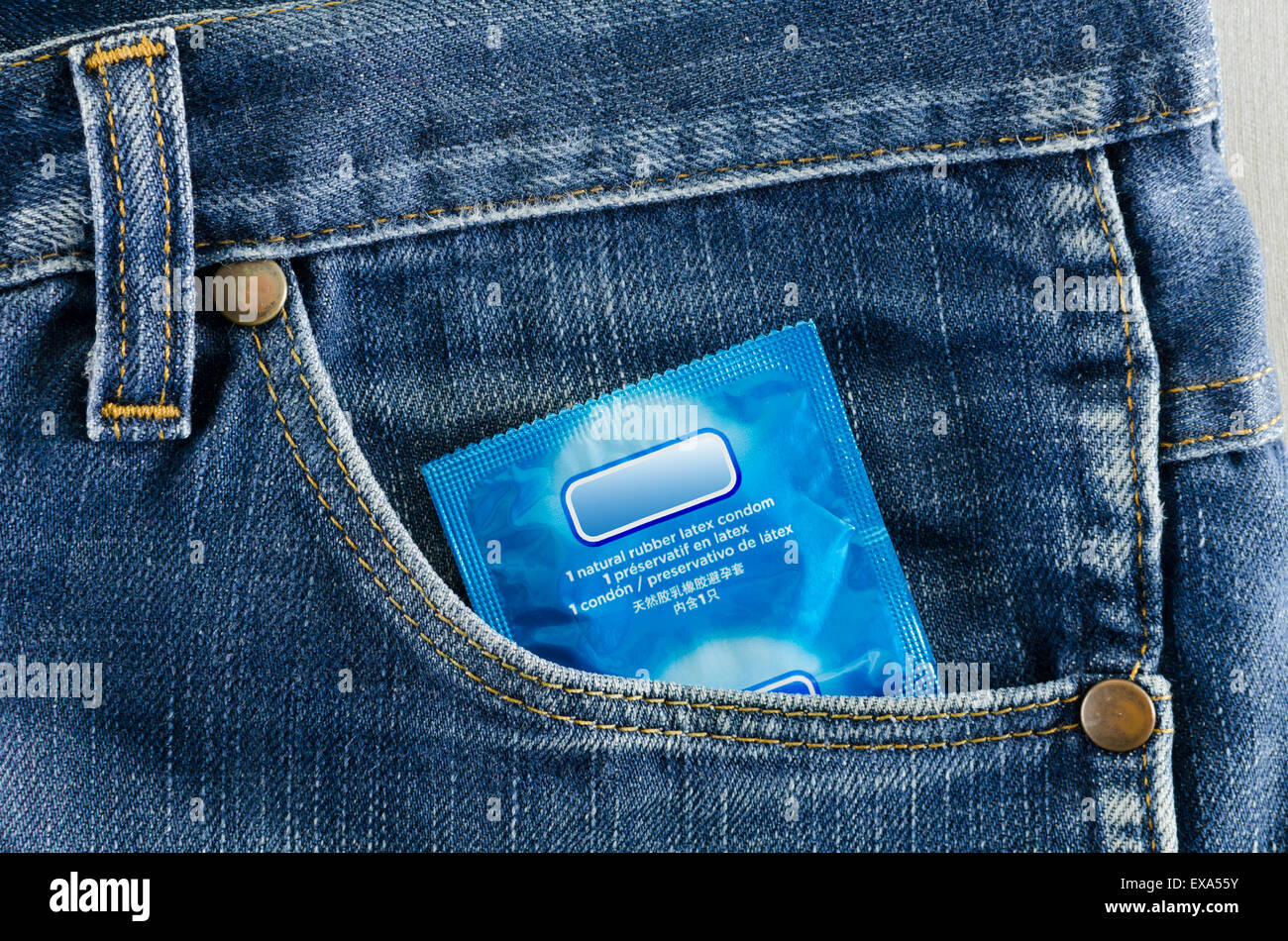 condom in the pocket of a blue jeans Stock Photo