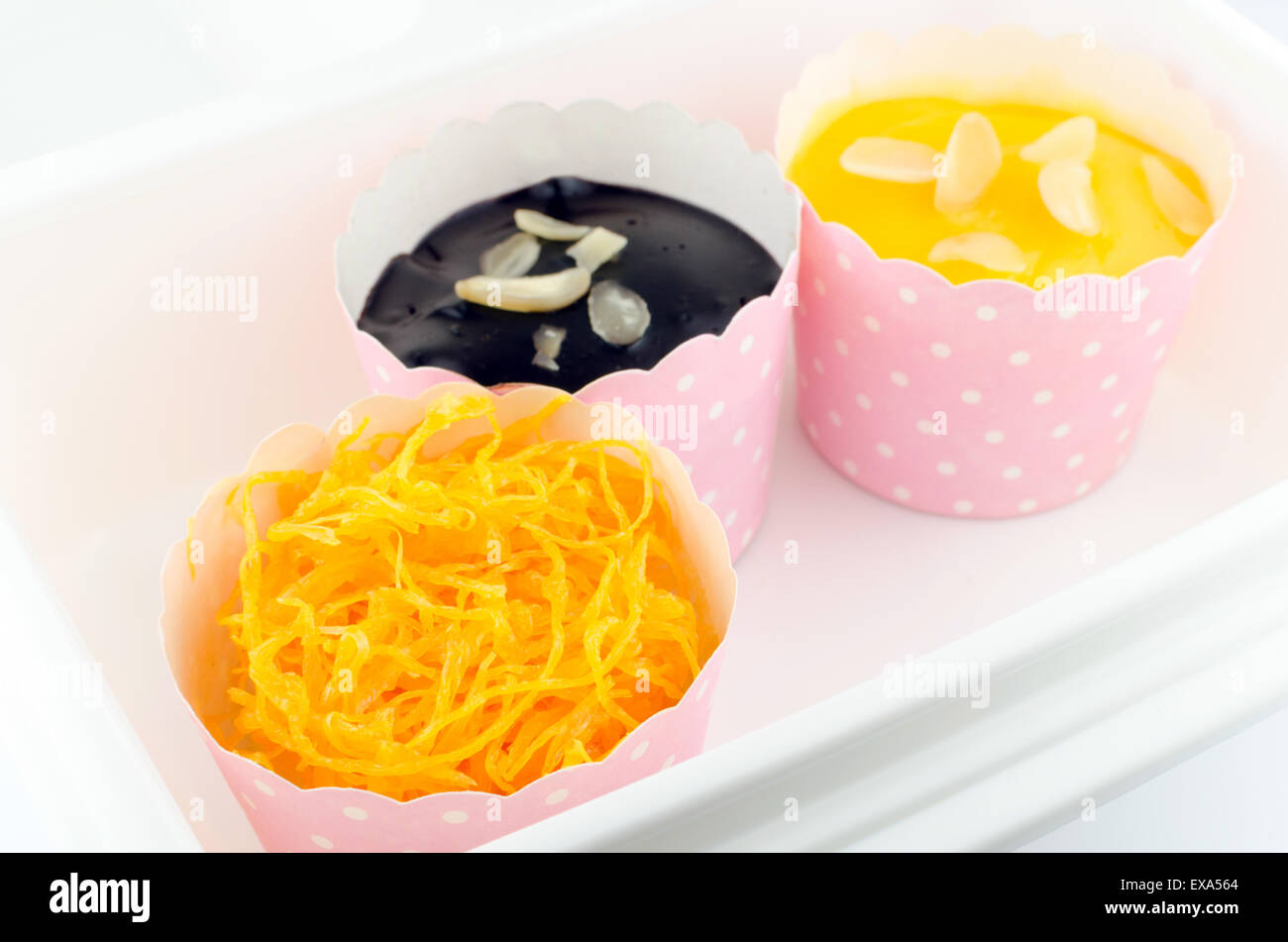 Cupcakes, flavor sweet egg,orange , chocolate isolated on white background. Stock Photo