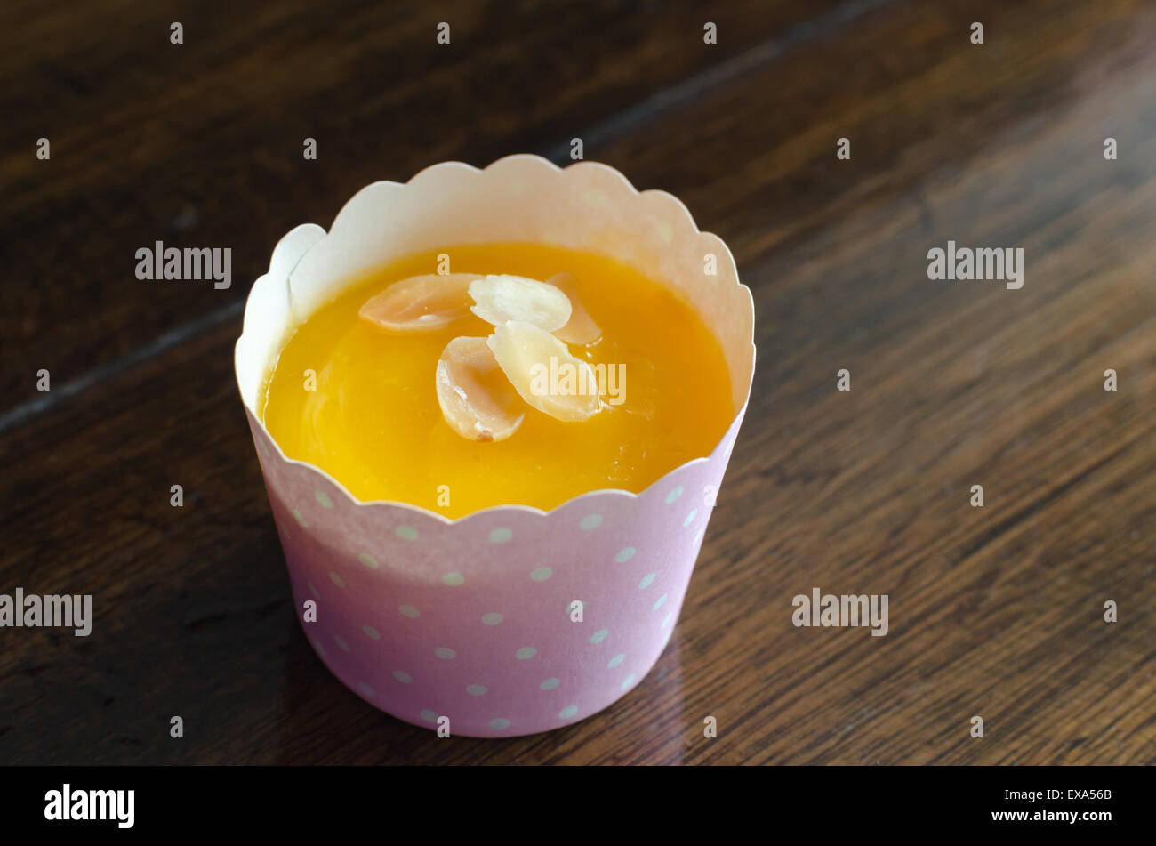 Cupcakes and sweet orange flavor on wood table. Stock Photo