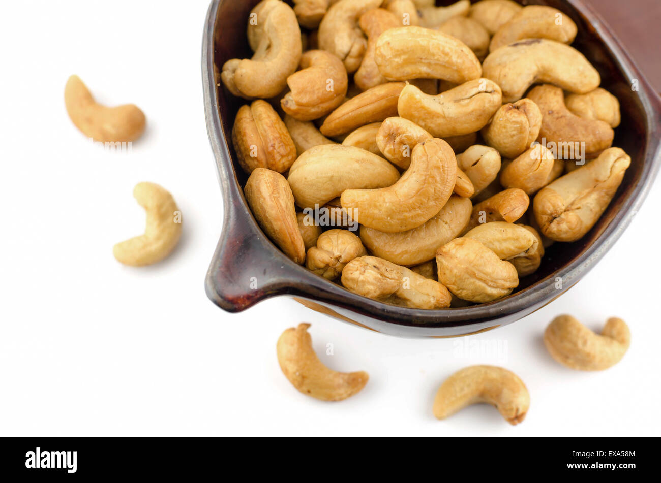 Roasted Cashew nuts are salty on white background Stock Photo