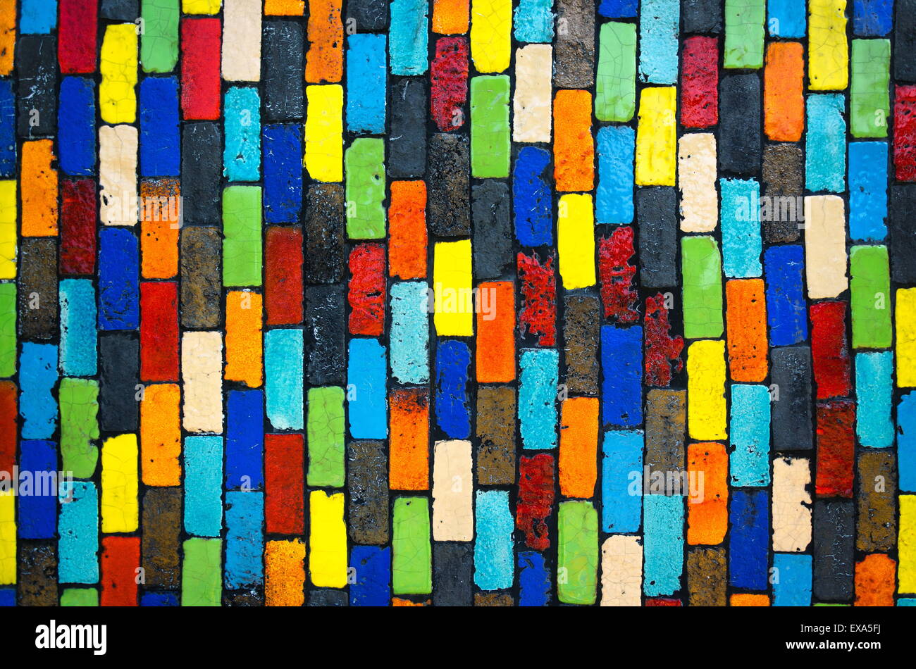 Colorful brick wall - beautiful variety colors red green yellow blue cement pattern background Stock Photo