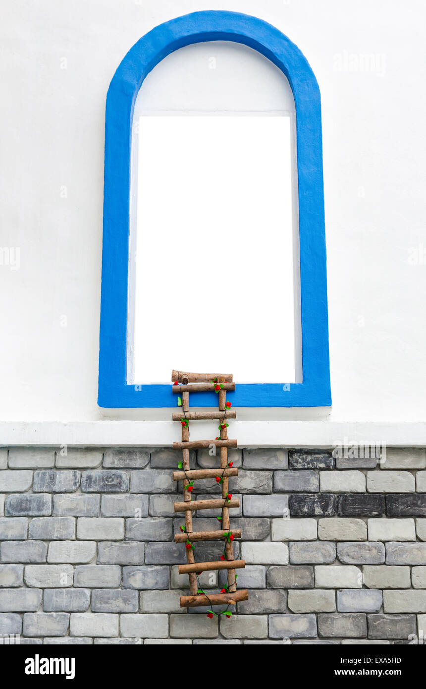 window with white copyspace and rope ladder on wall. Stock Photo