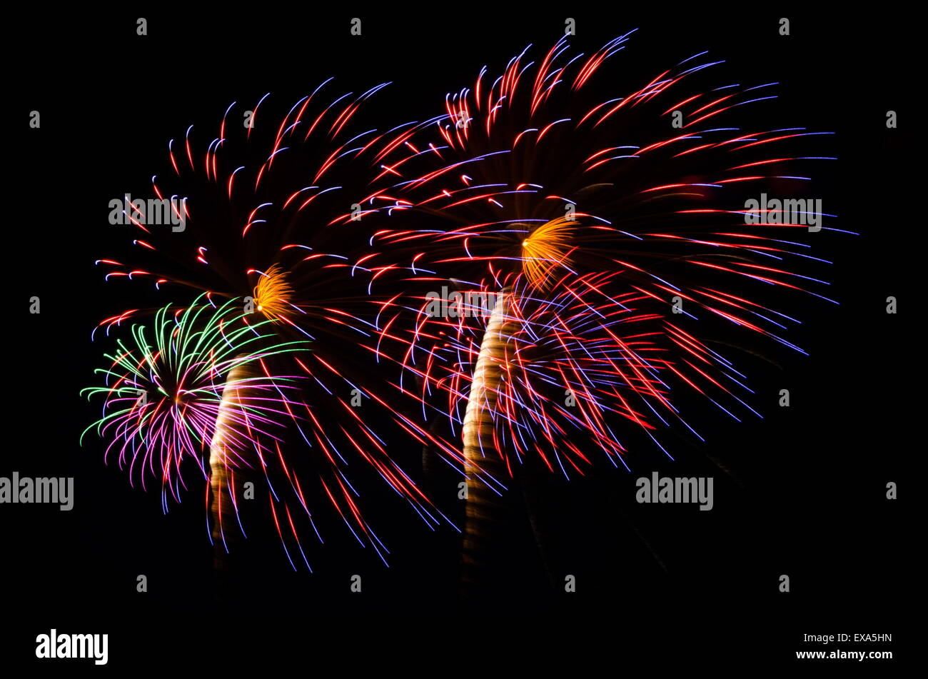 An image of exploding fireworks at night. Represents a celebration. Stock Photo