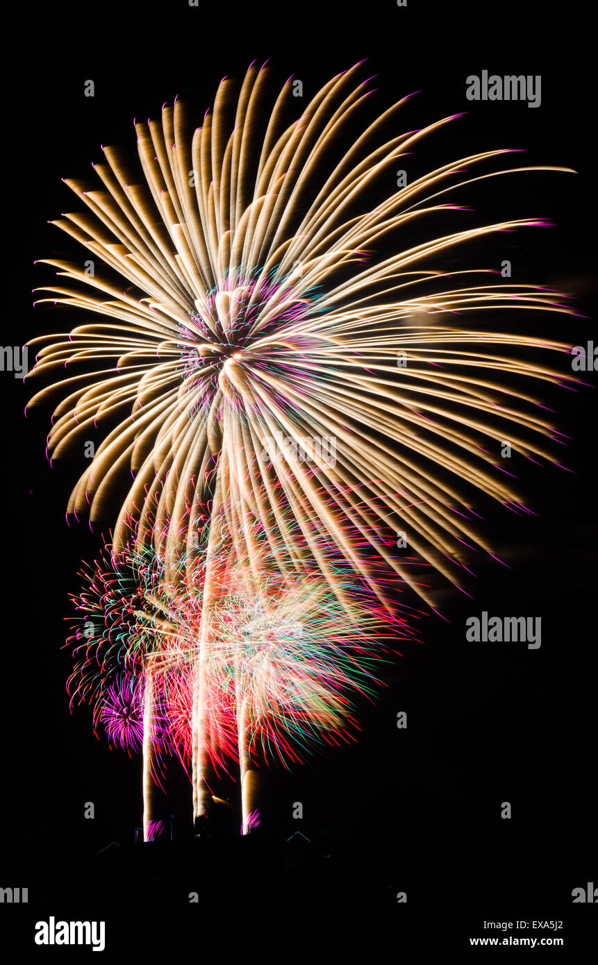 An image of exploding fireworks at night. Represents a celebration. Stock Photo