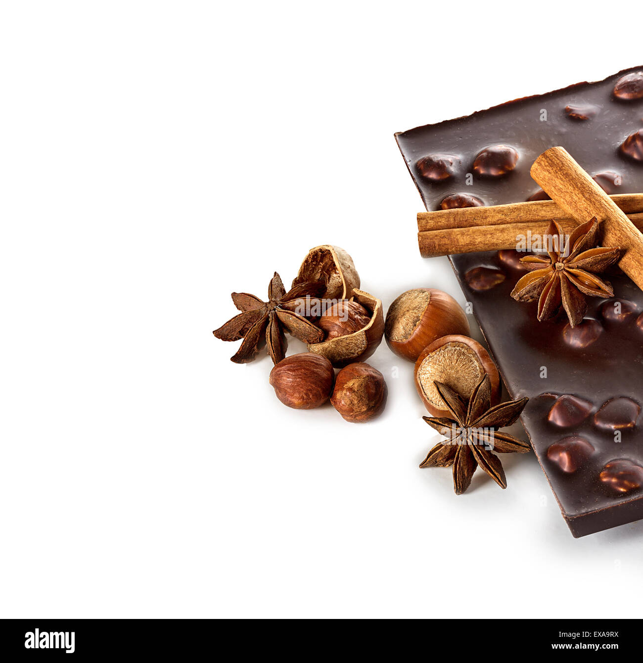 Chocolate and nuts with cinnamon sticks, star anise isolated Stock Photo