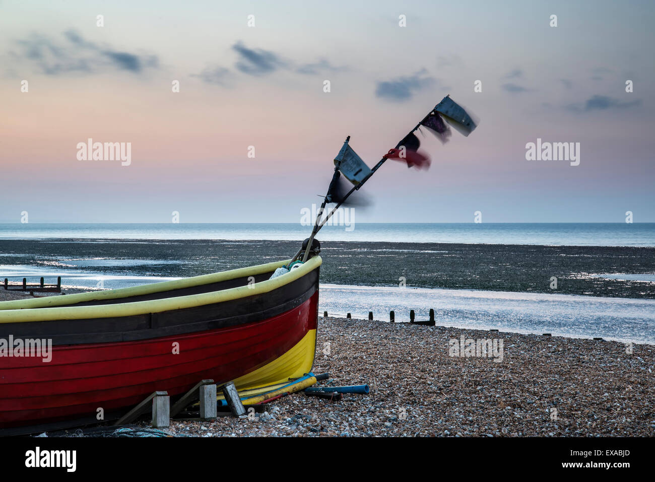 Landscape image of small fishing boats on beach at sunrise Stock Photo ...