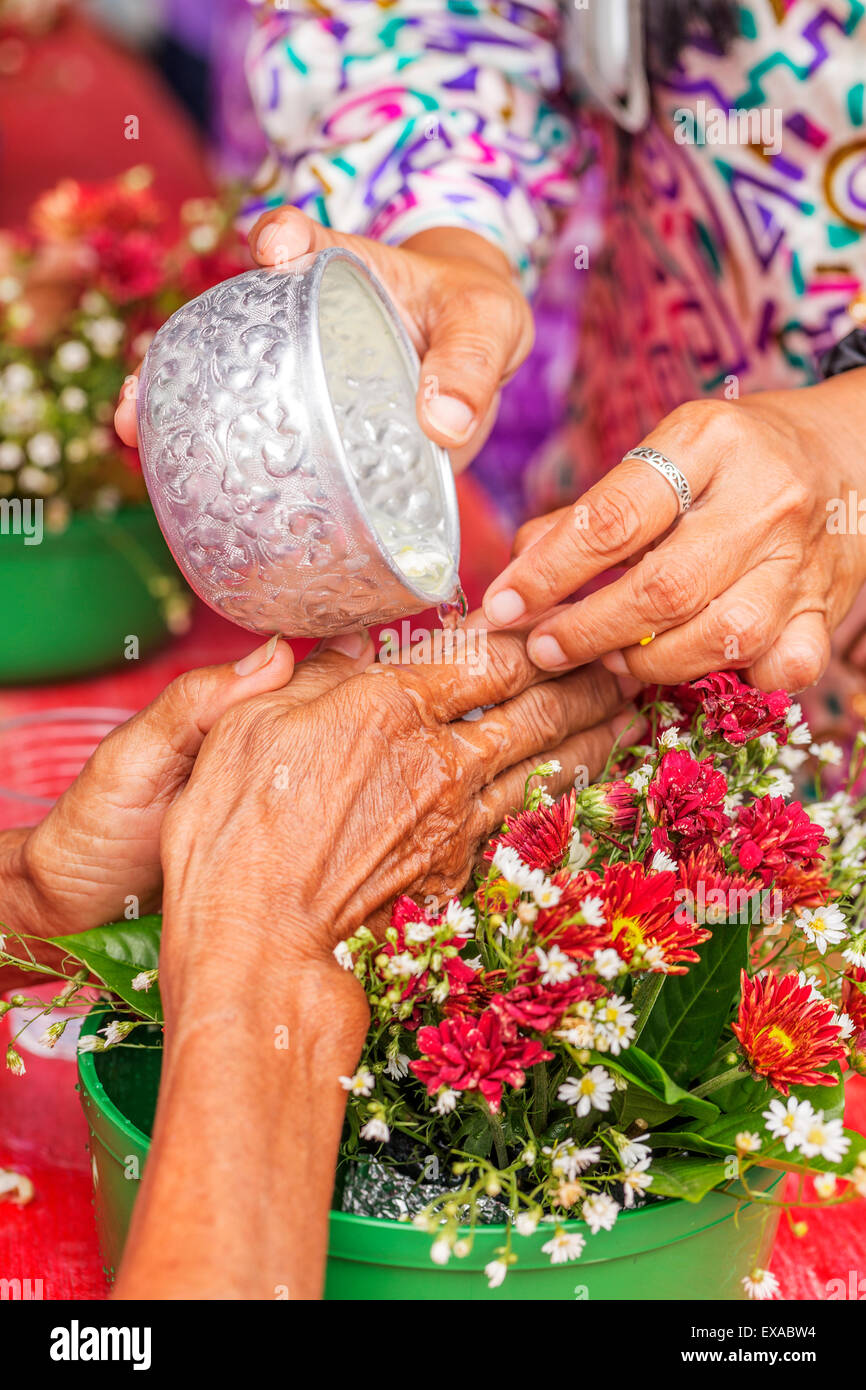 Water pouring to Buddha statue in Songkran festival tradition of