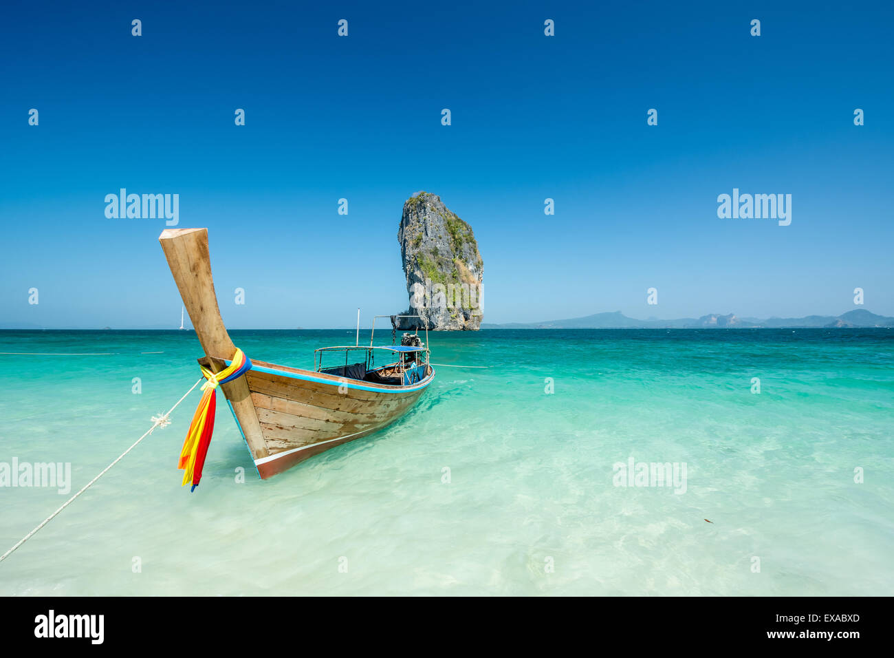 Cliff and boat in the amazing beach in tropical island in Krabi, Phuket, Thailand Stock Photo