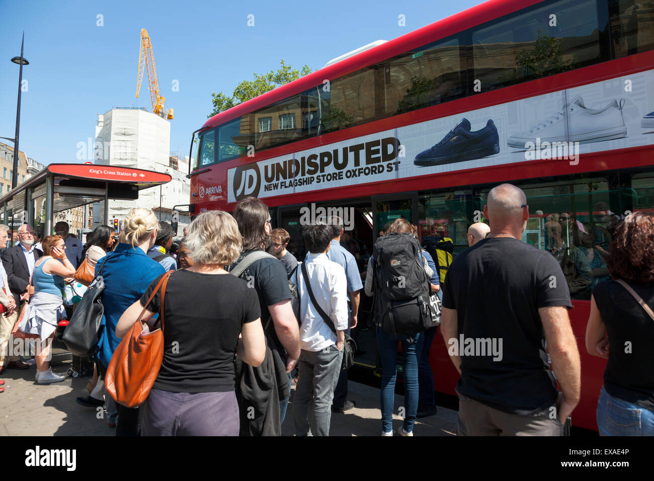 London, UK. 9 July 2015 - The biggest strike on the London Underground in 13 years is causing commuter chaos across the city. At St Pancras International and King's Cross stations both travelers arriving on the Eurostar and national rail trains, as well as regular Londoner's are stuck on crowded bus stops and packed buses. Credit: Nathaniel Noir/Alamy Live News Stock Photo