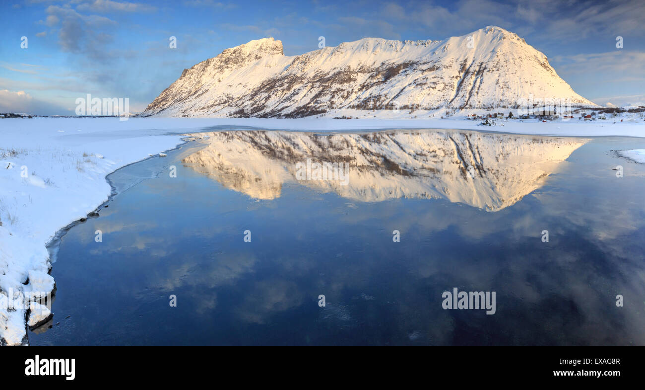 Snow capped mountains reflected in Steiropollen lake at sunrise, Lofoten Islands, Northern Norway, Arctic, Norway, Scandinavia Stock Photo