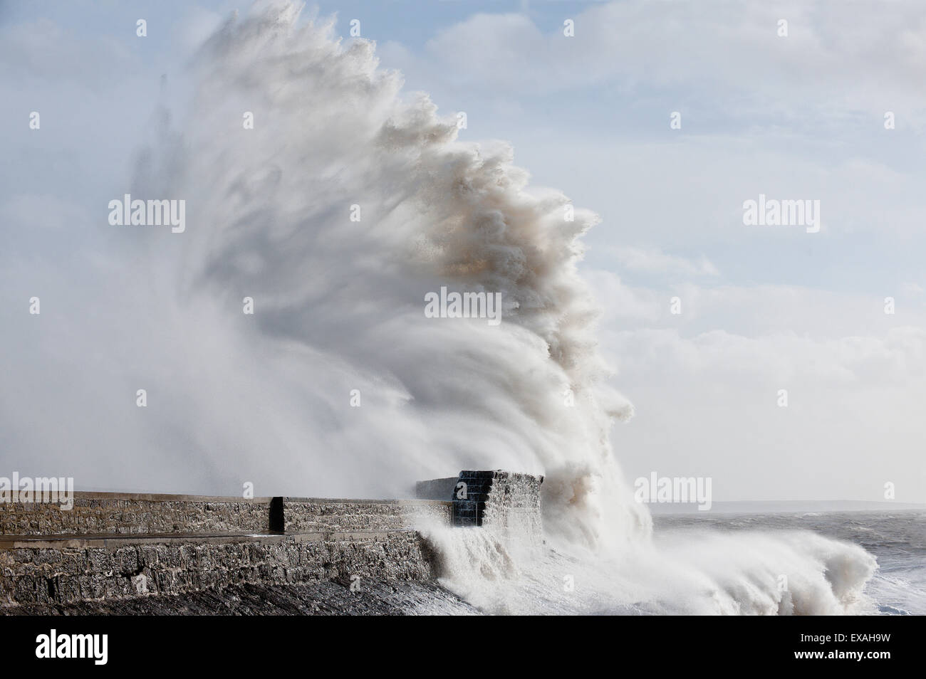 Waves crash against the harbour wall at Porthcawl, Bridgend, Wales, United Kingdom, Europe Stock Photo