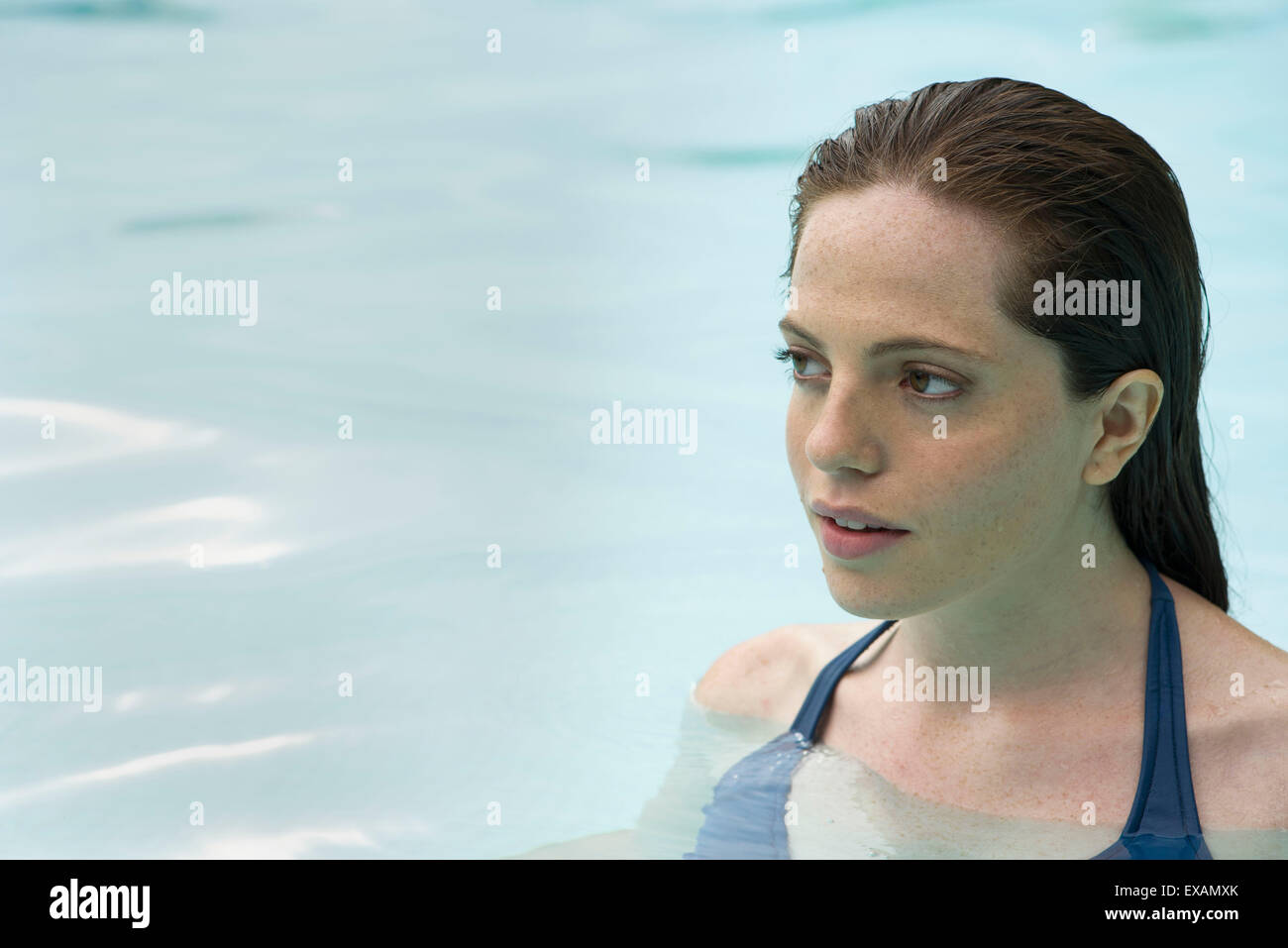 Woman relaxing in swimming pool Stock Photo - Alamy
