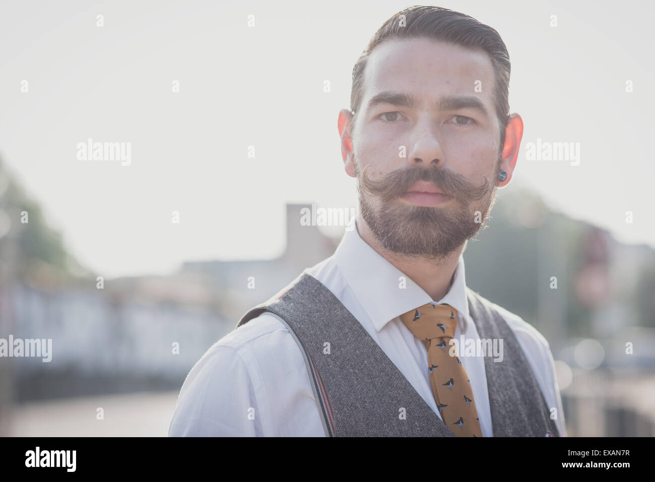 handsome big moustache hipster man in the city Stock Photo