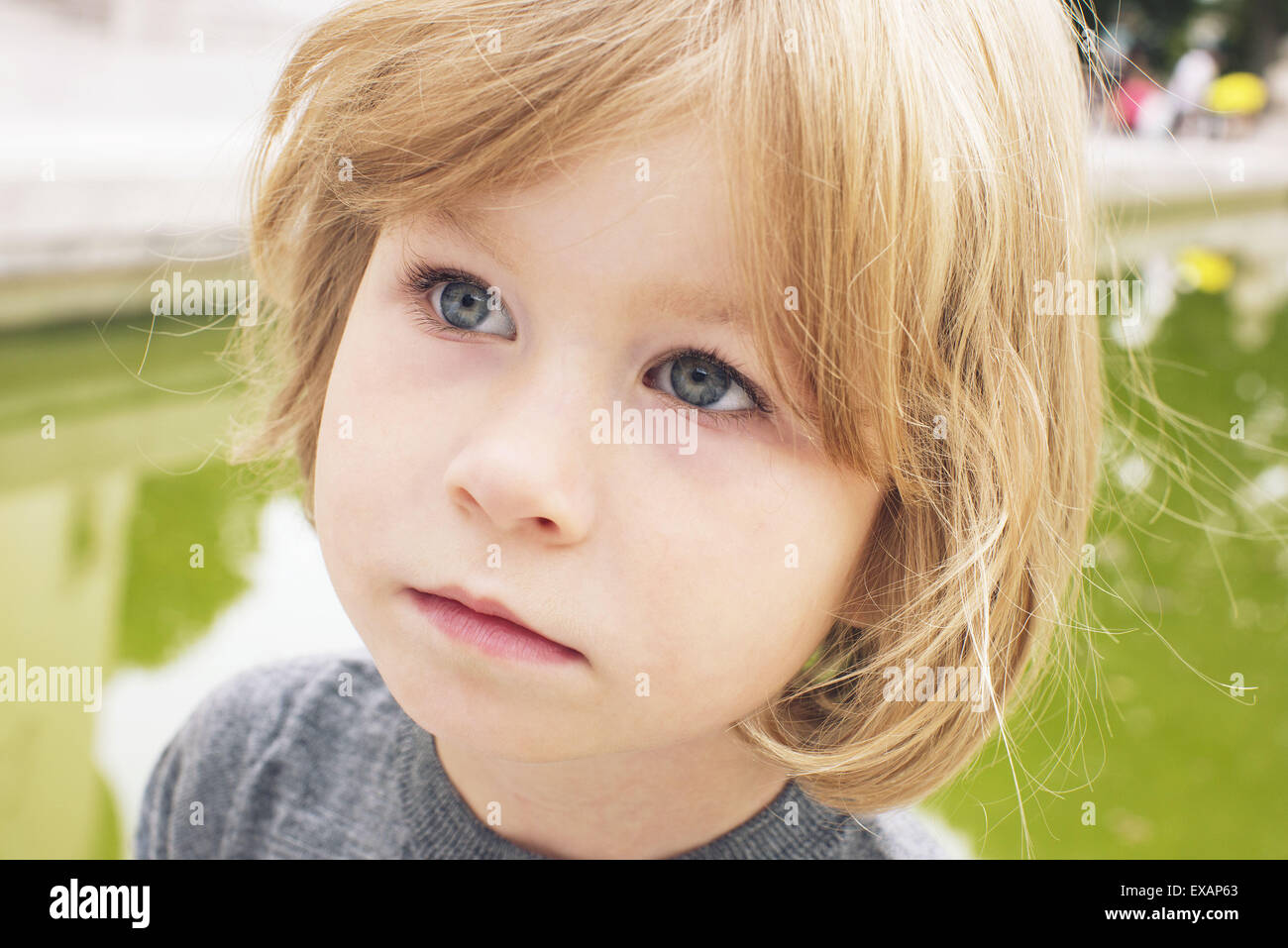 Little girl looking away in thought, portrait Stock Photo