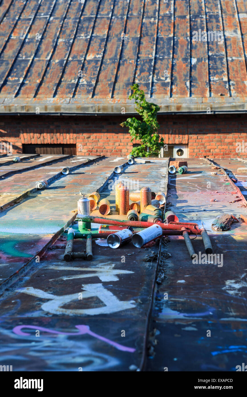 Used graffiti spray cans laying around Stock Photo - Alamy