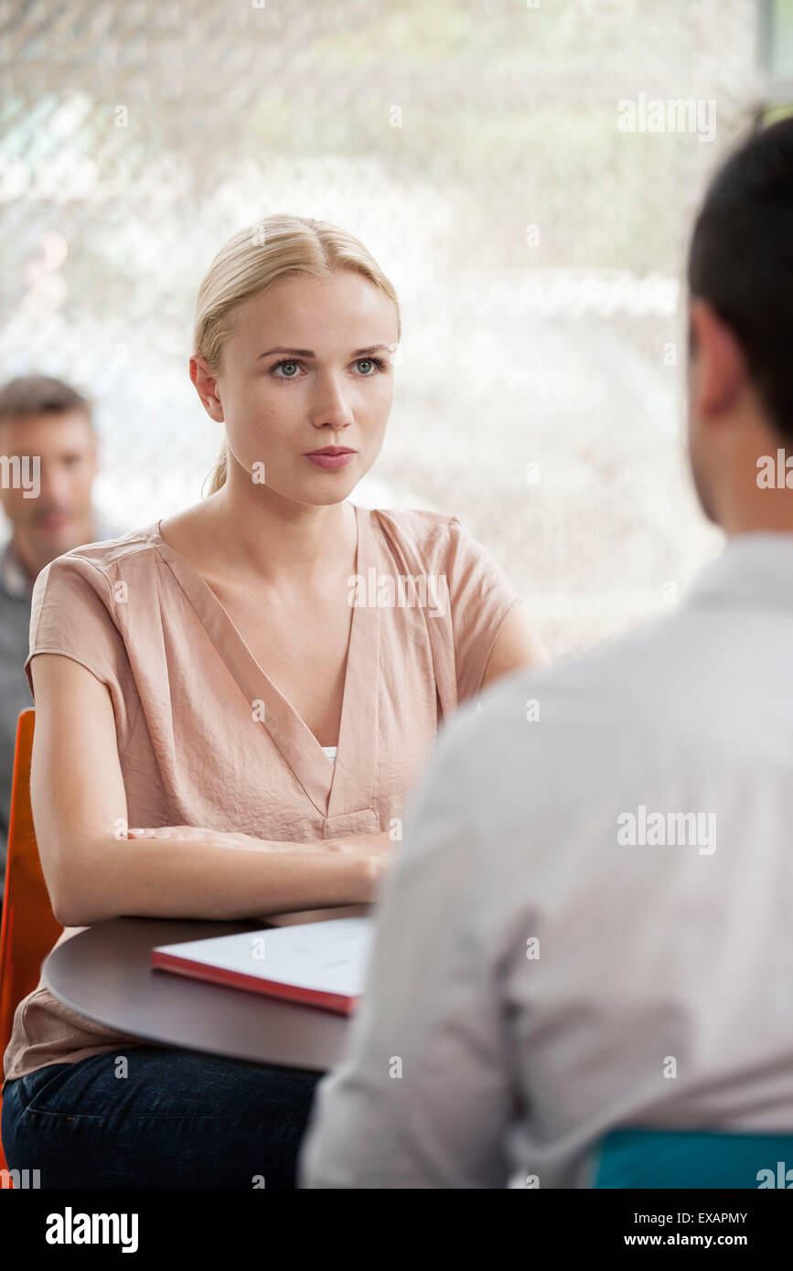 Woman having informal meeting with colleague Stock Photo