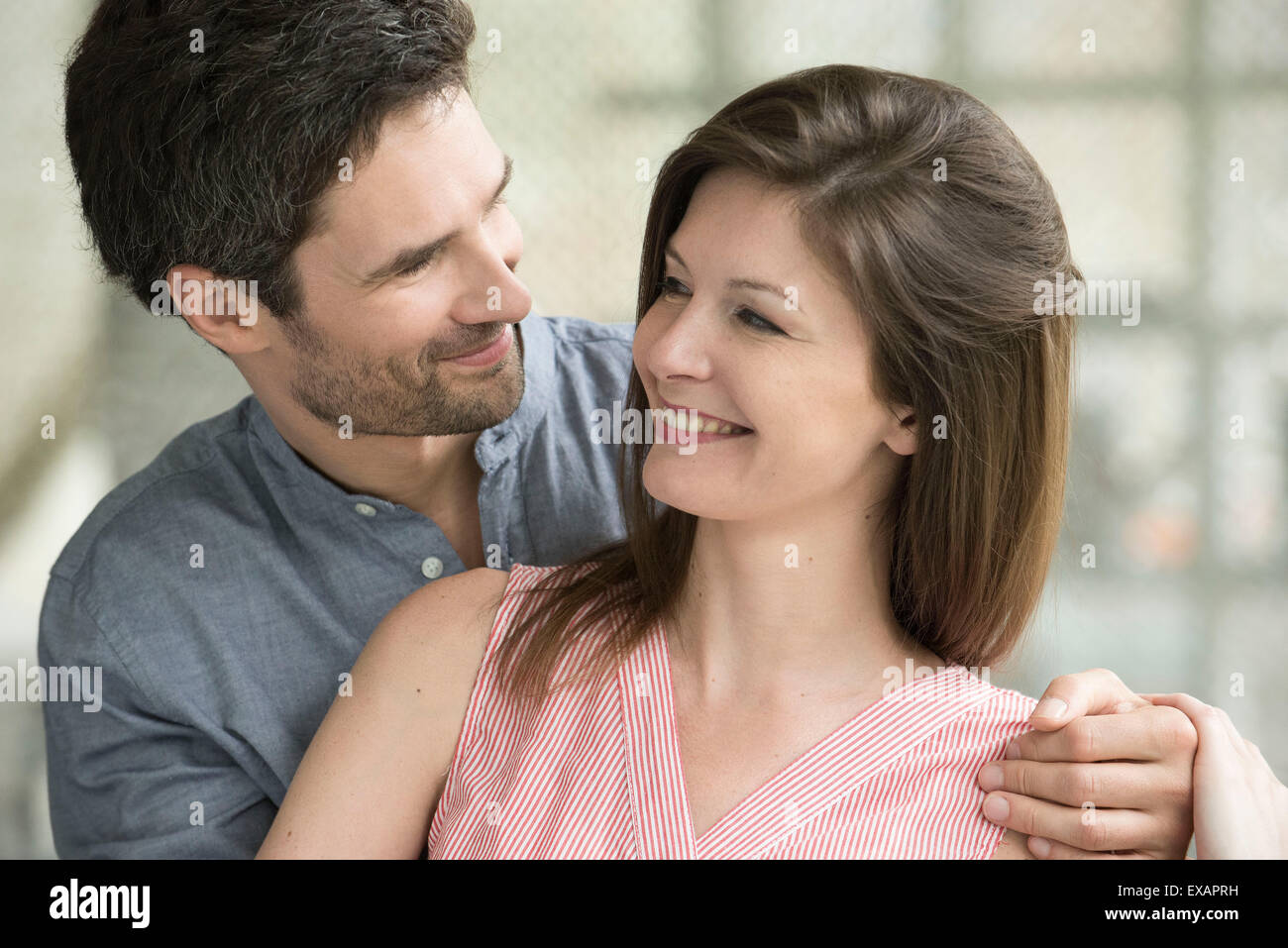 Couple smiling at each other Stock Photo