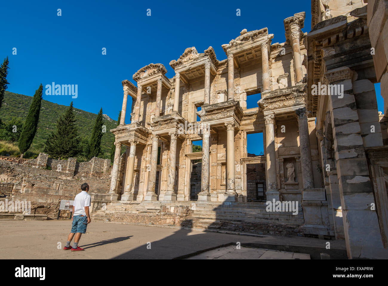 Caucasian tourist watching the Library of Celsus, Ephesus, Izmir, Turkey Stock Photo