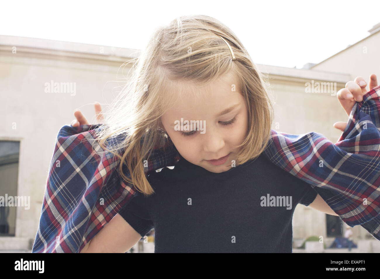 Little girl playing outdoors Stock Photo