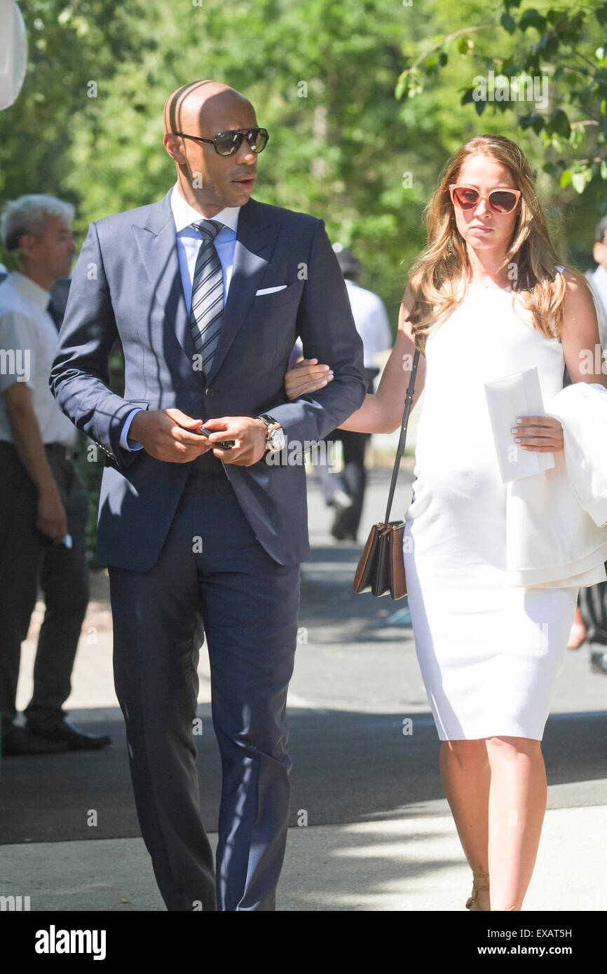 Wimbledon London,UK. 10th July 2015. Former Arsenal footballer Thierry Henry arrives with his girlfriend Andrea Rajacic at the AELTC  on Men's Semi final day of the 2015 Wimbledon Tennis championships Credit:  amer ghazzal/Alamy Live News Stock Photo