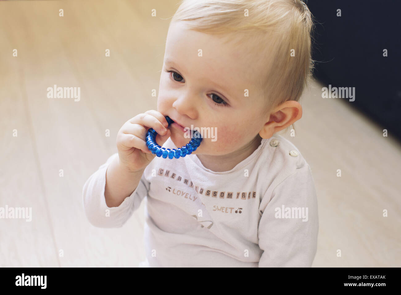Baby chewing on teething ring Stock Photo