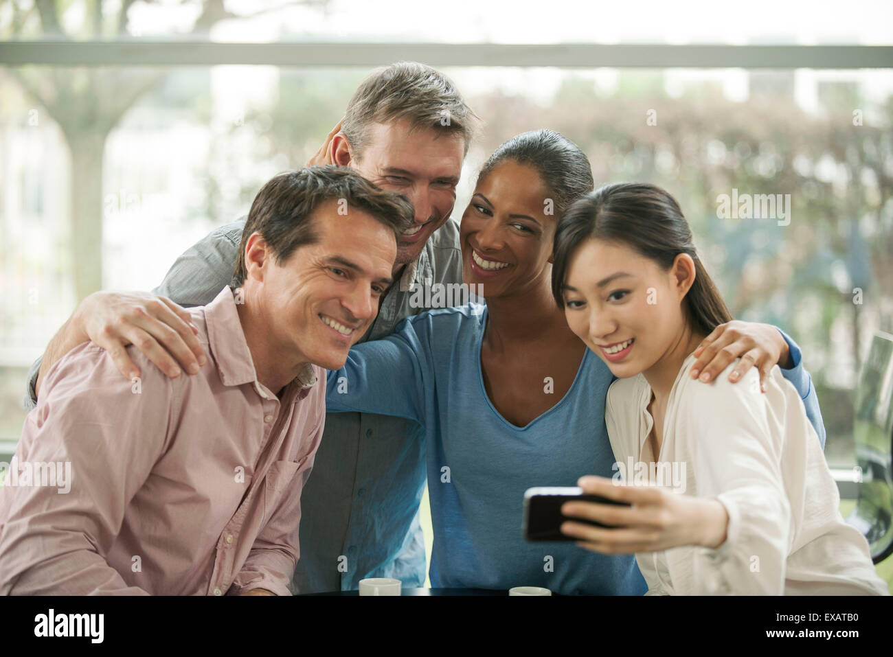 Friends posing together for selfie Stock Photo - Alamy