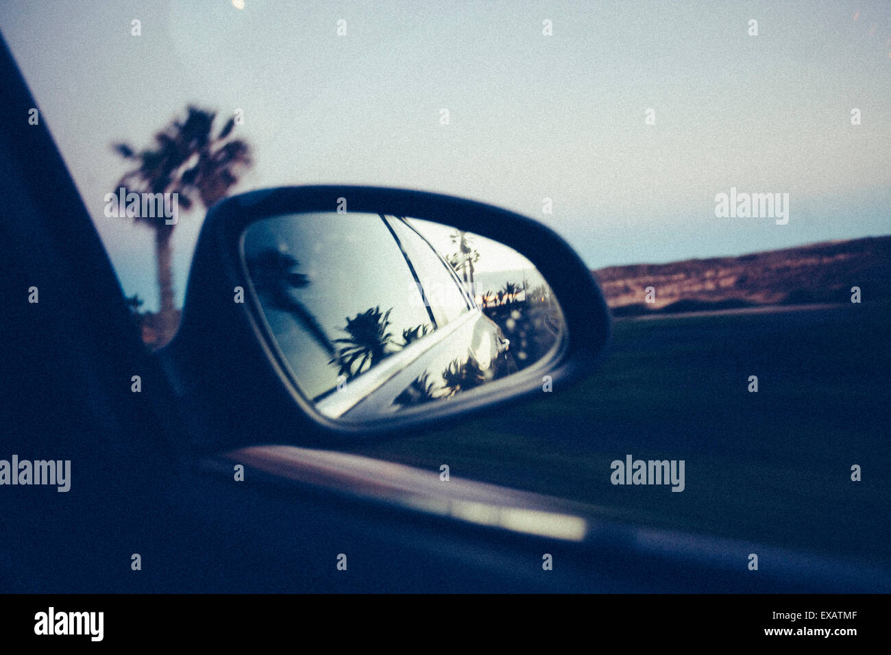 View in the rear-view mirror - Roadtrip Stock Photo