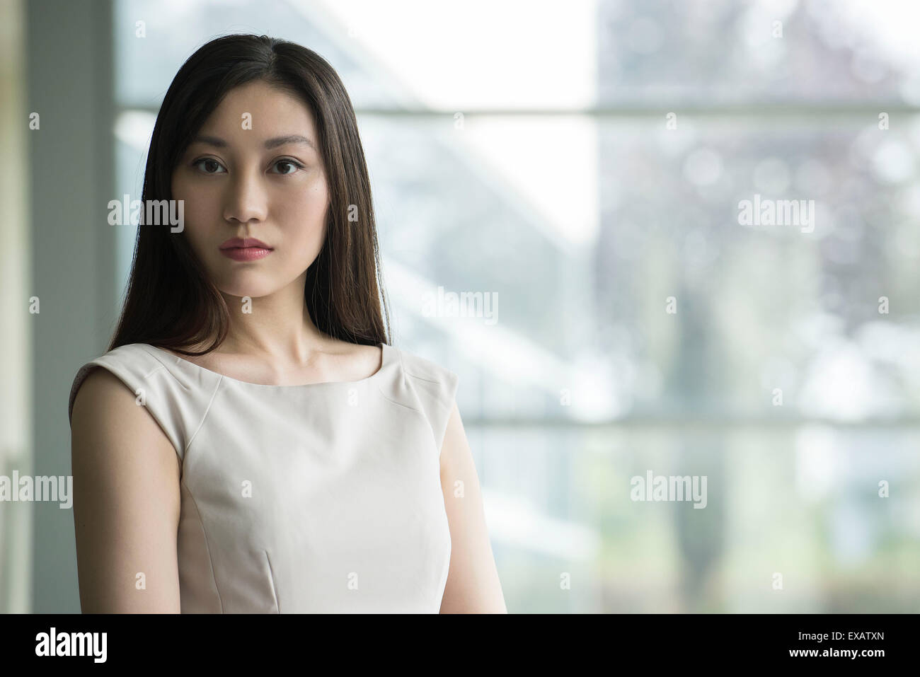 Serious long haired woman hi-res stock photography and images - Alamy