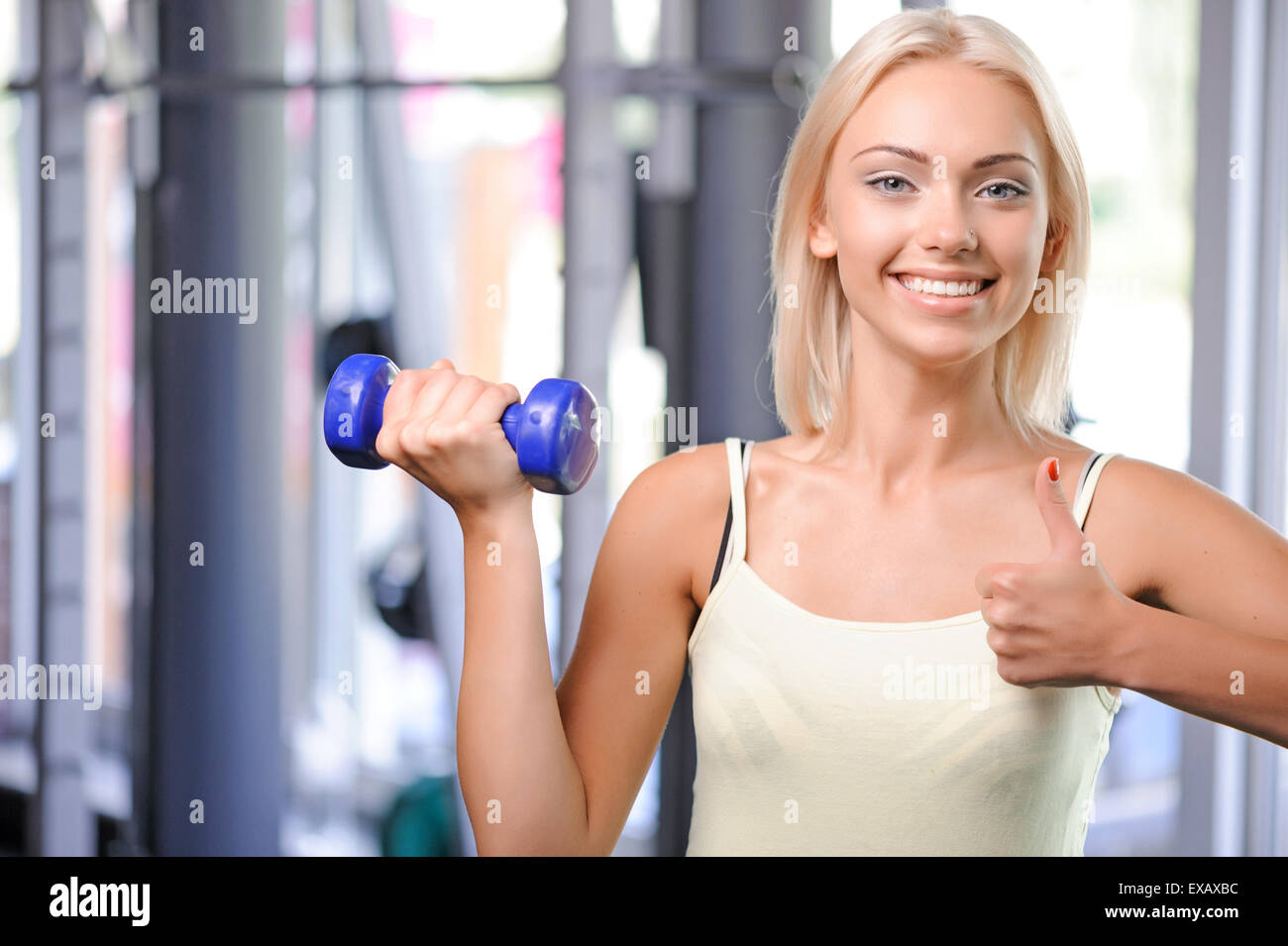 Fit girl with dumbbell Stock Photo Alamy