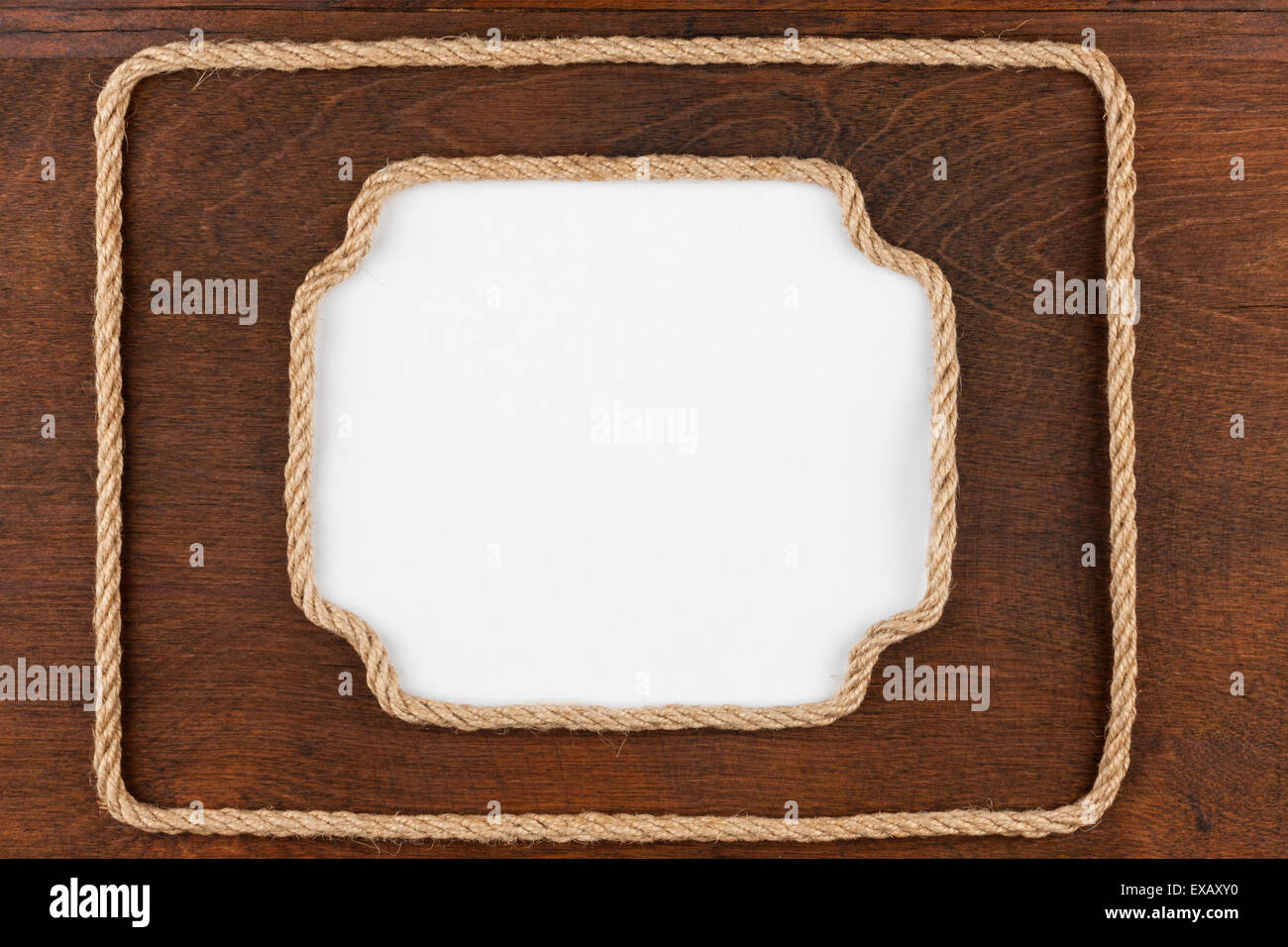 Two frame of rope with a white background, lies on wooden surface, with ...