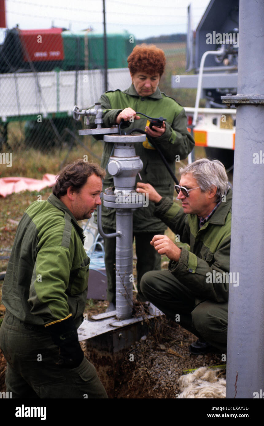 Slovakia: workers in green overalls testing a gas pipeline. Stock Photo